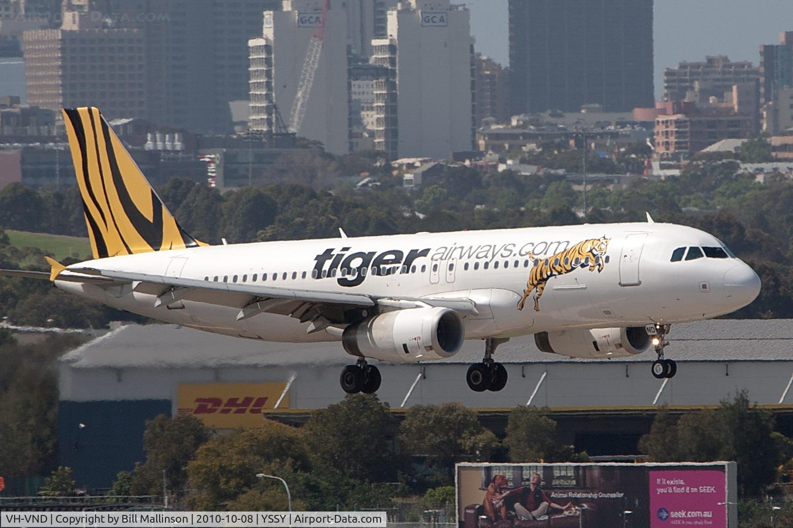 VH-VND, 2007 Airbus A320-232 C/N 3296, CITY IN THE BACKGROUND