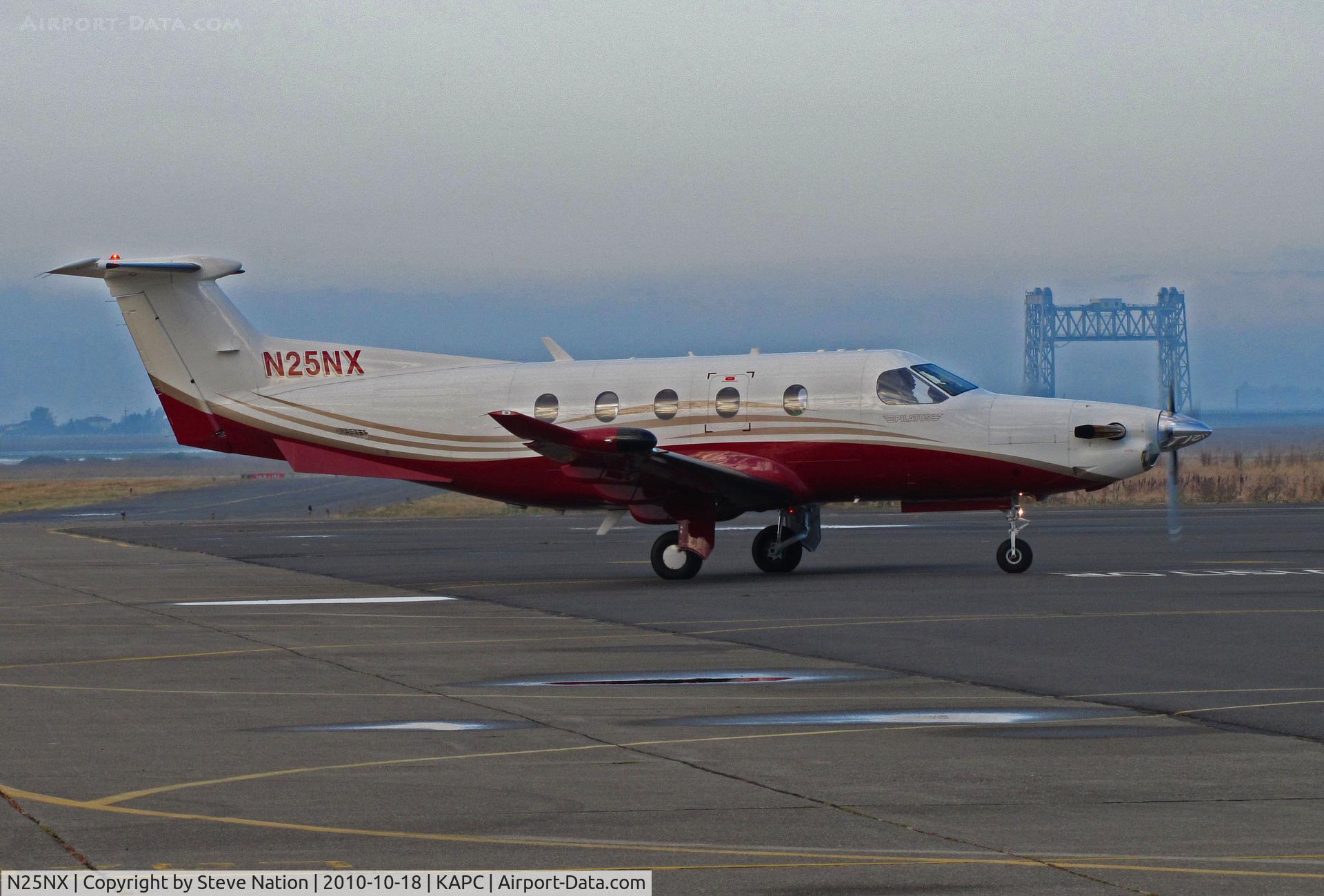 N25NX, 2009 Pilatus PC-12/47E C/N 1125, Niner Leasing 2009 PC-12/47E arriving at Napa, CA from KOAK with Napa River RR Bridge in background
