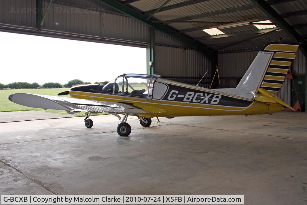 G-BCXB, 1974 Socata Rallye 100ST Galopin C/N 2546, Morane Saulnier Rallye 100T in it's hangar at Fishburn Airfield, July 2010.