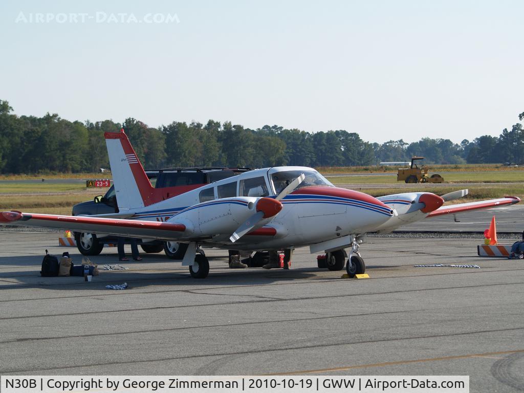N30B, 1966 Piper PA-30 Twin Comanche C/N 30-1381, Pre-flight loading of luggage for departure from Goldsboro-Wayne
