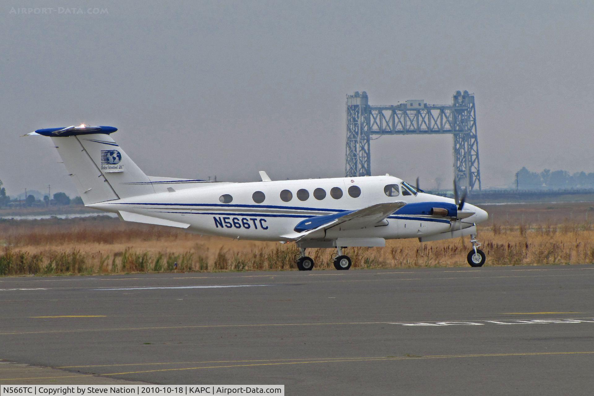 N566TC, 1983 Beech B200 Super King Air King Air C/N BB-1145, Framed by the Napa River RR Bridge Brokers International (Panora, IA) 1993 King Air B200 taxis for flight to KSDA (Scottsdale, AZ)