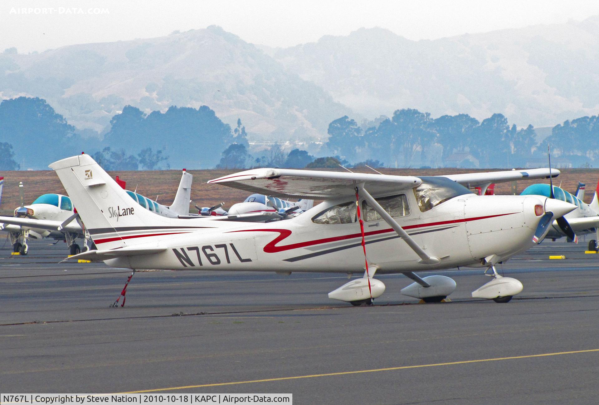 N767L, 2002 Cessna 182T Skylane C/N 18281122, DSL Aeroventures 2002 Cessna 182T on visitors ramp with Napa Valley morning mist in background