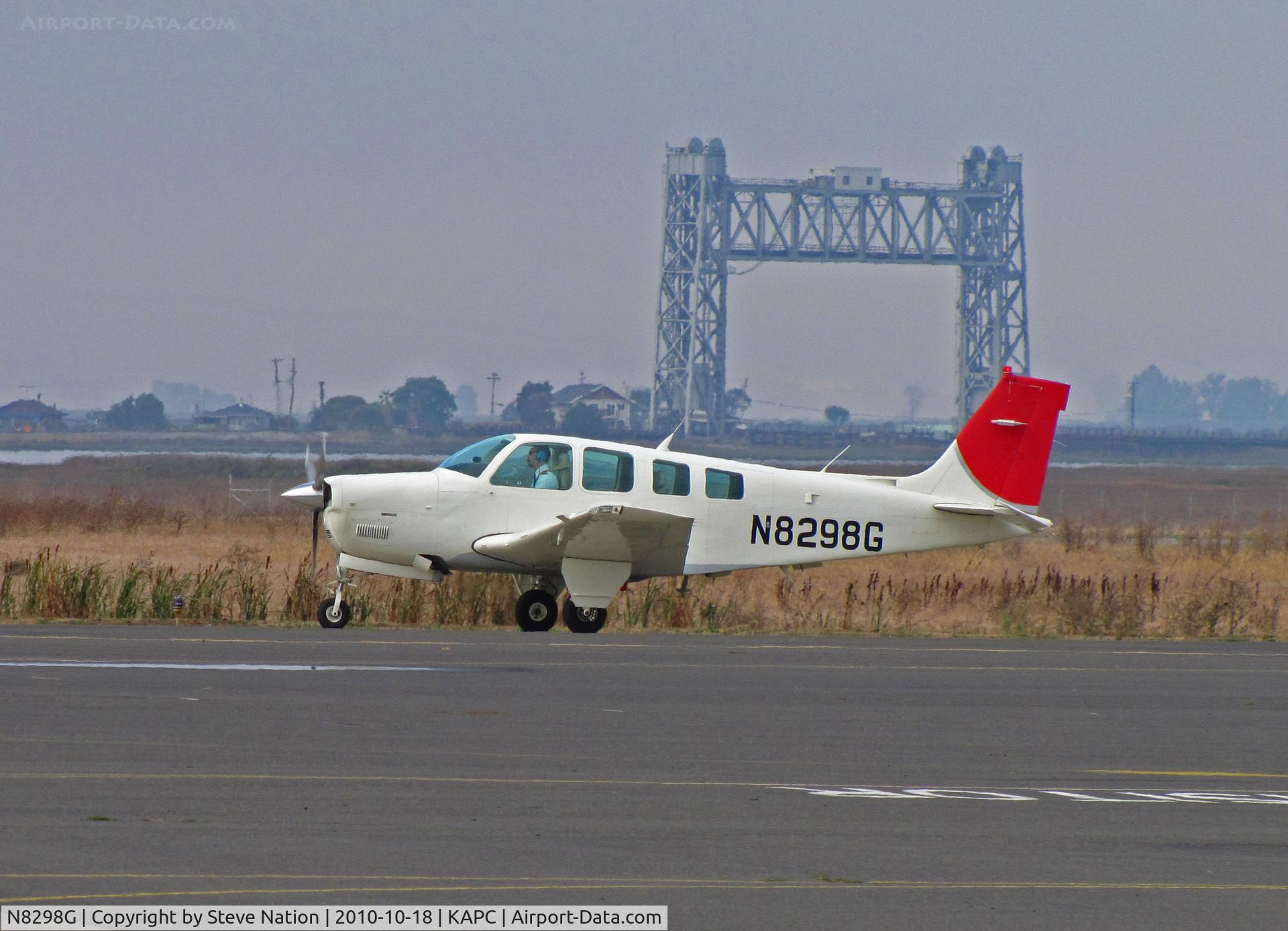 N8298G, 1992 Beech A36 Bonanza 36 C/N E-2765, 1992 Beech A36 taxis past Napa River RR Bridge for check flight with JAL/Japan Airlines titles painted over (JAL closed their IASCO-run US training program in October 2010)