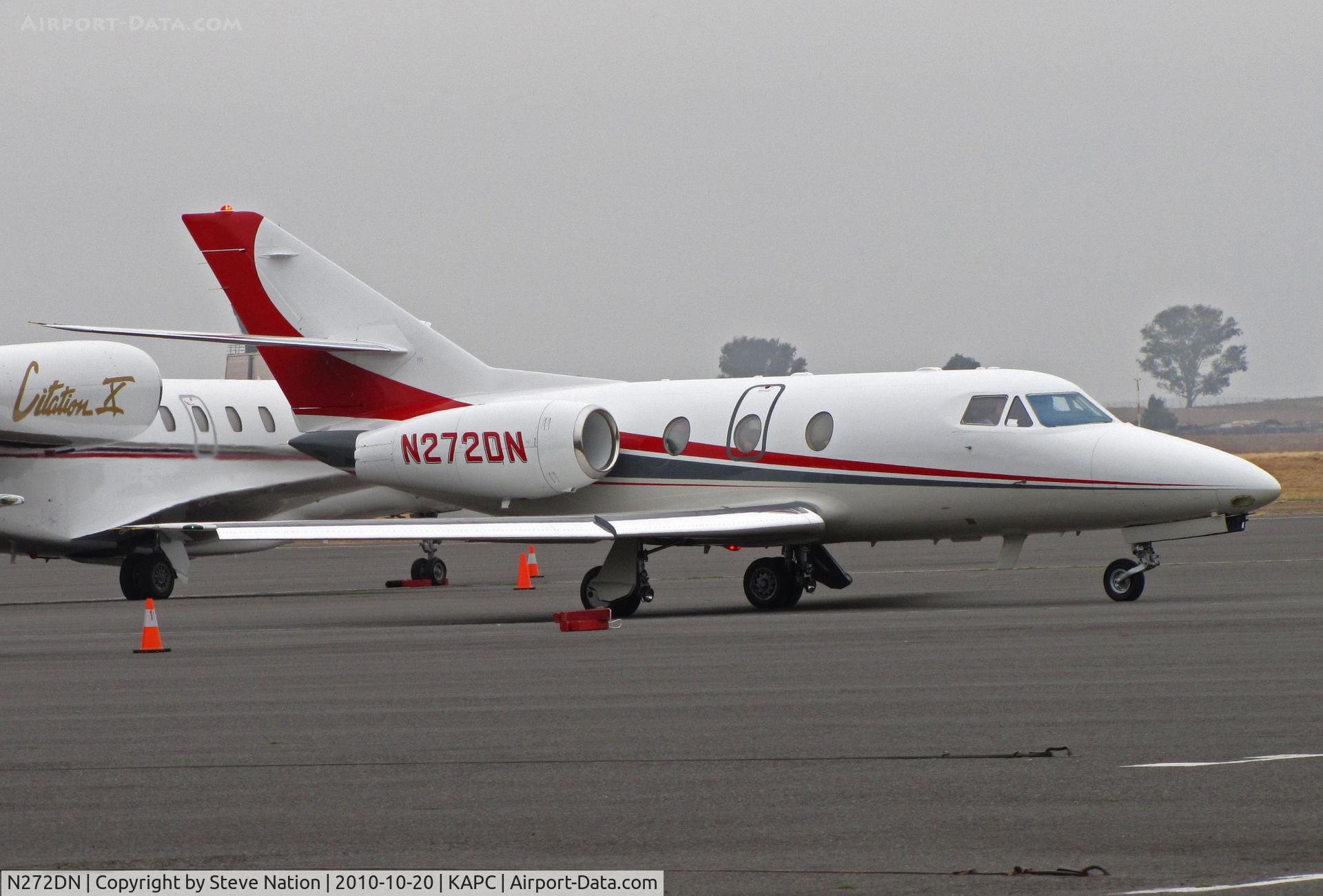 N272DN, 1978 Dassault-Breguet Falcon 10 C/N 135, American Equity Investment Properties (W Des Moines, IA) 1978 Falcon 10 taxis across crowded Napa bizjet ramp