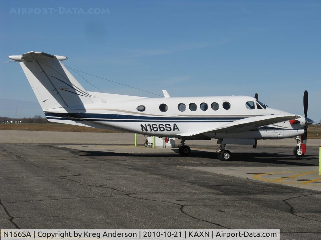 N166SA, 1988 Beech 300 C/N FA-166, Beech 300 Super King Air parked between the fuel pumps.