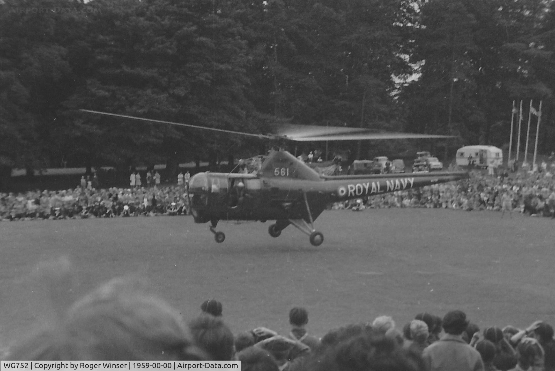 WG752, Westland Dragonfly HR.5 C/N WA/H/62, Off airport. Fleet Air Arm Dragonfly HR.3 helicopter coded 561 of 727 NAS's ASR Flight  based at RNAS Brawdy (HMS Goldcrest), Pembrokeshire seen during a rescue demonstration in Singleton Park, Swansea, Wales, UK circa 1959.