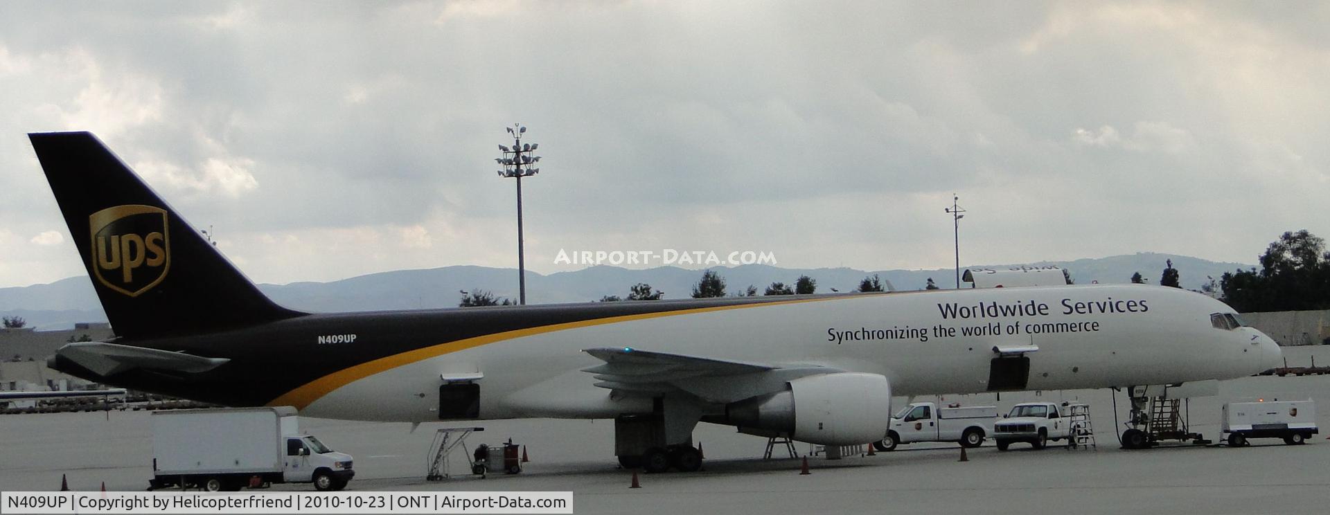 N409UP, 1988 Boeing 757-24APF C/N 23731, Parked in UPS parking area southeast portion of Airport and being loaded