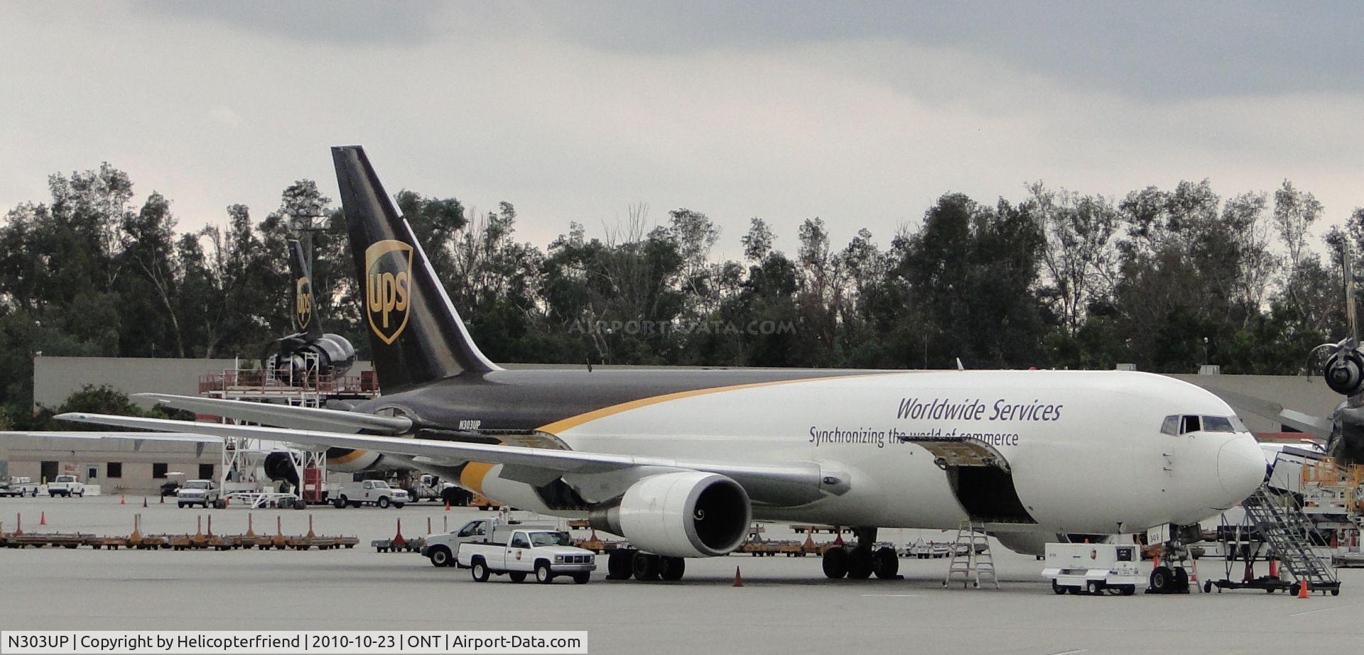 N303UP, 1995 Boeing 767-34AF C/N 27241, Parked in UPS parking area southeast portion of Airport and being loaded