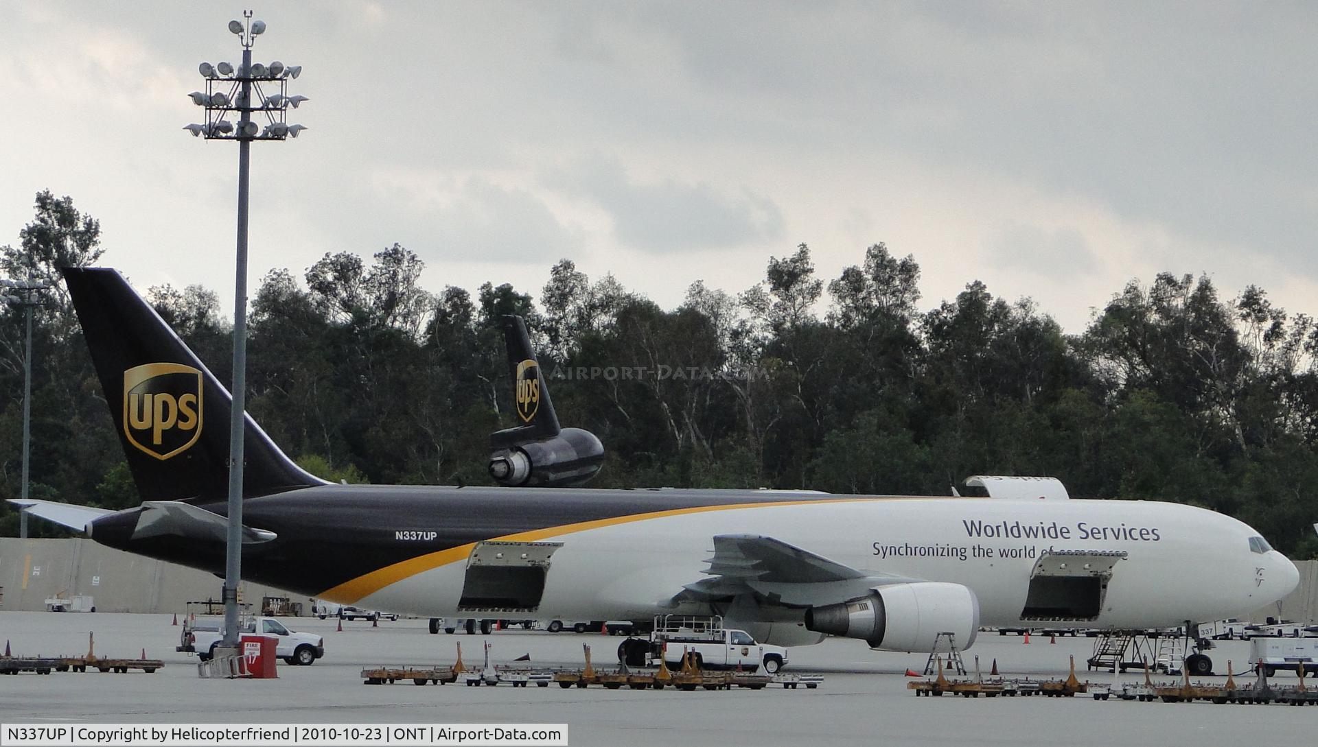 N337UP, 2010 Boeing 767-34AFER C/N 37858, Parked in UPS parking area southeast portion of Airport and being loaded