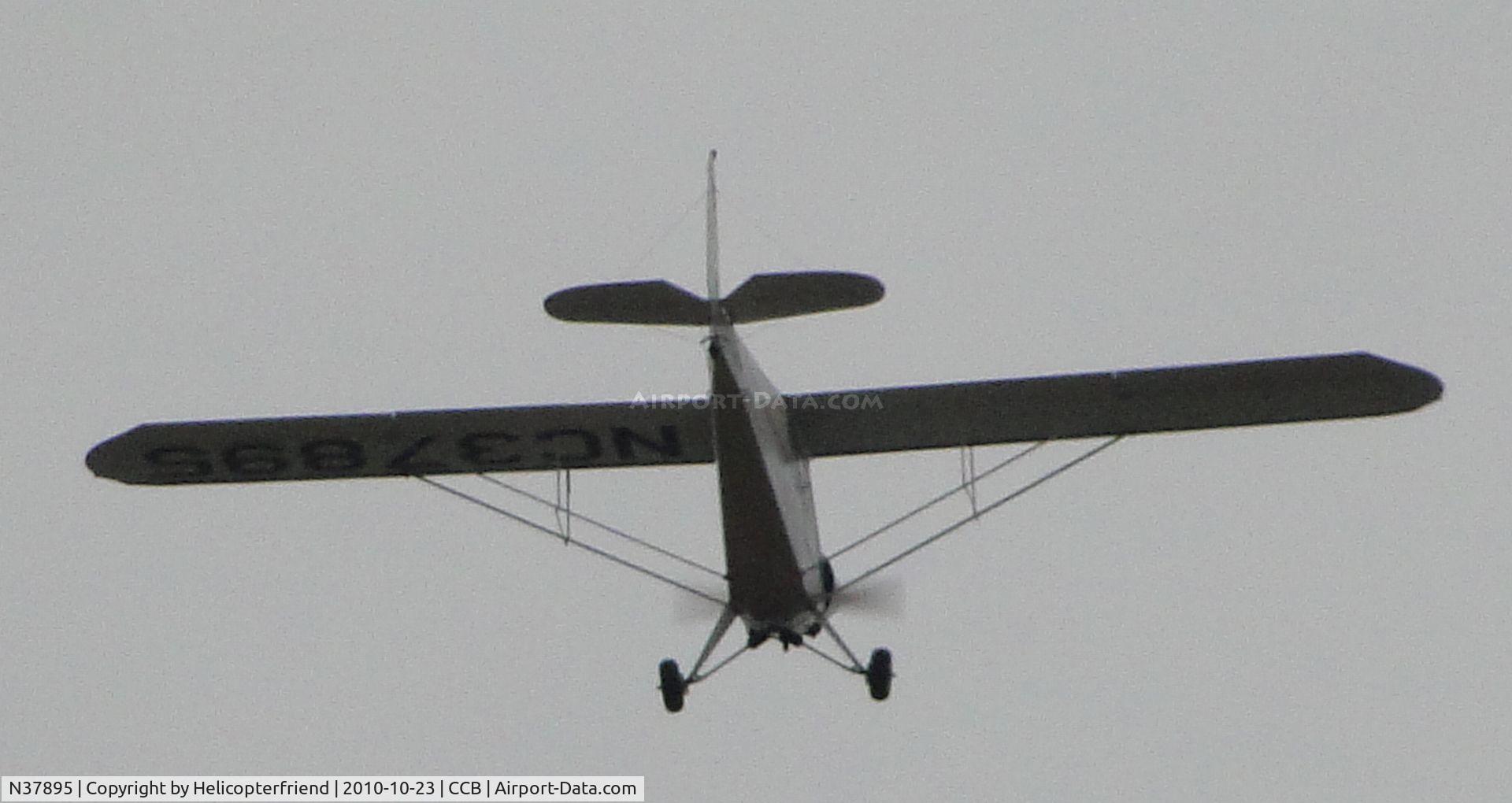 N37895, 1941 Porterfield CP-65 C/N 1025, Crossing active runway heading northeast