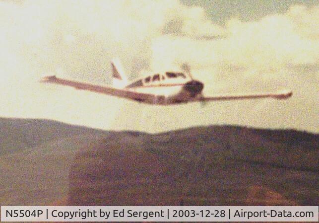 N5504P, 1958 Piper PA-24-250 Comanche C/N 24-567, 5504P over Granby Co. airport.Pilot Charles Chandler..partner owner...year 1983