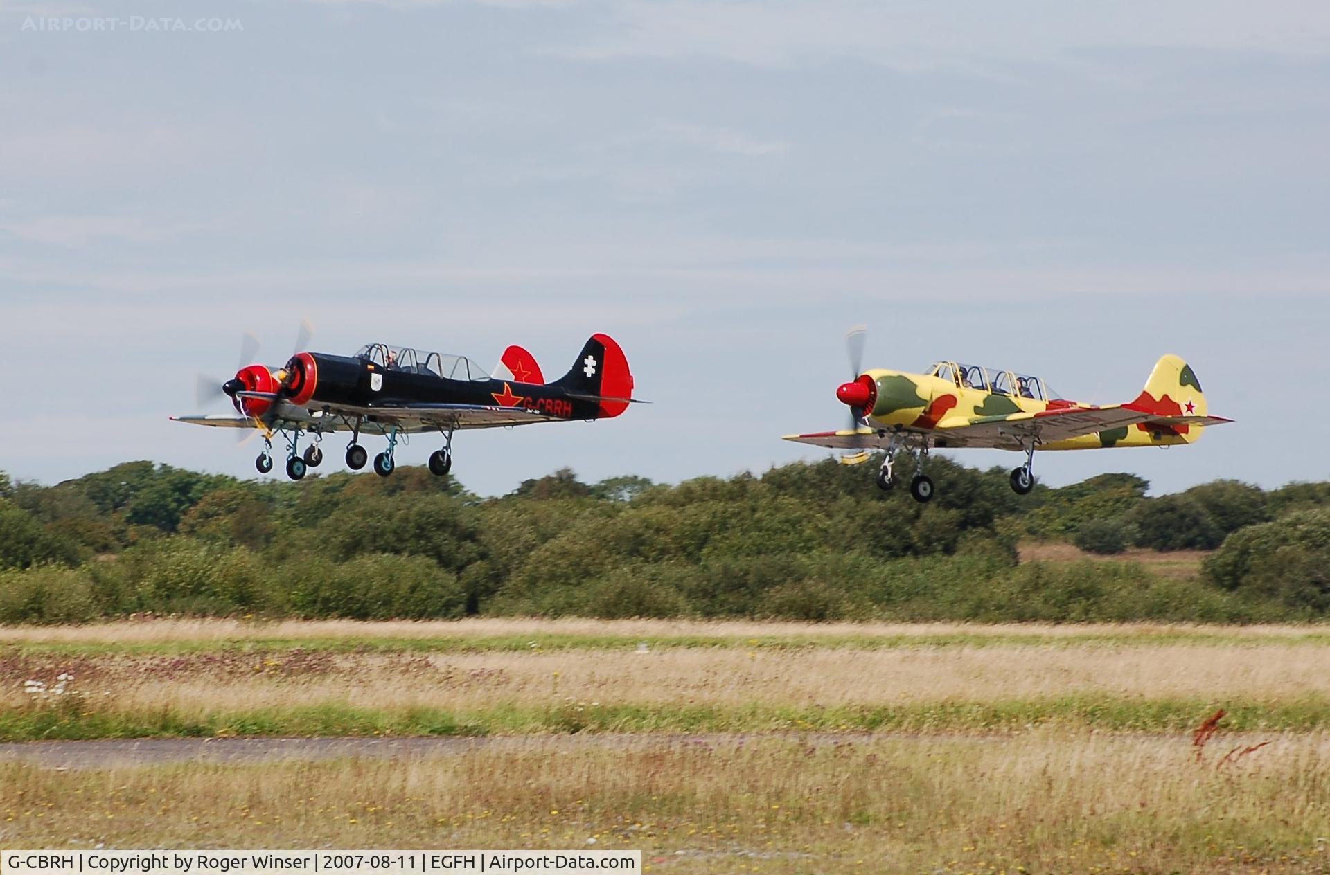 G-CBRH, 1984 Yakovlev Yak-52 C/N 844815, G-CBRH leading G-YFUT and G-BVVA in a formation takeoff.