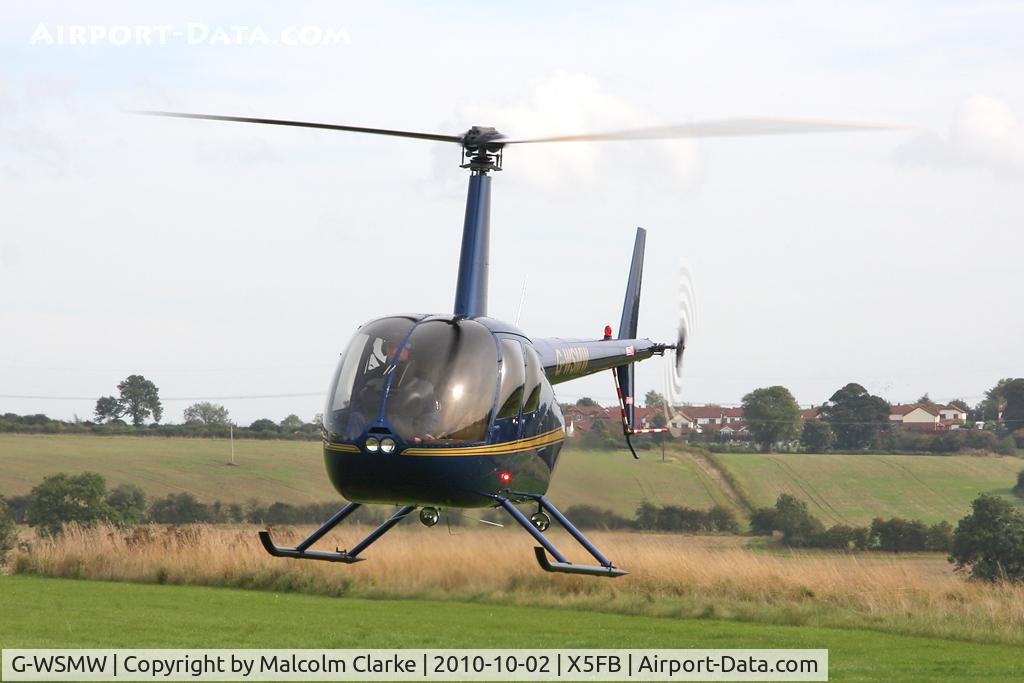 G-WSMW, 2009 Robinson R44 Raven C/N 2068, Robinson R44 Raven manoeuvring for refuelling at Fishburn Airfield, October 2010.