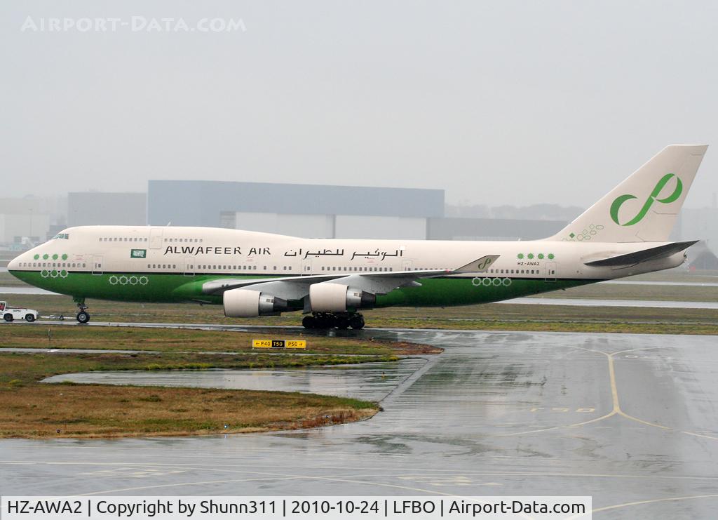HZ-AWA2, 1997 Boeing 747-4H6 C/N 28426, Trackted parking 'Delta 24' after landed 3 hours ago...