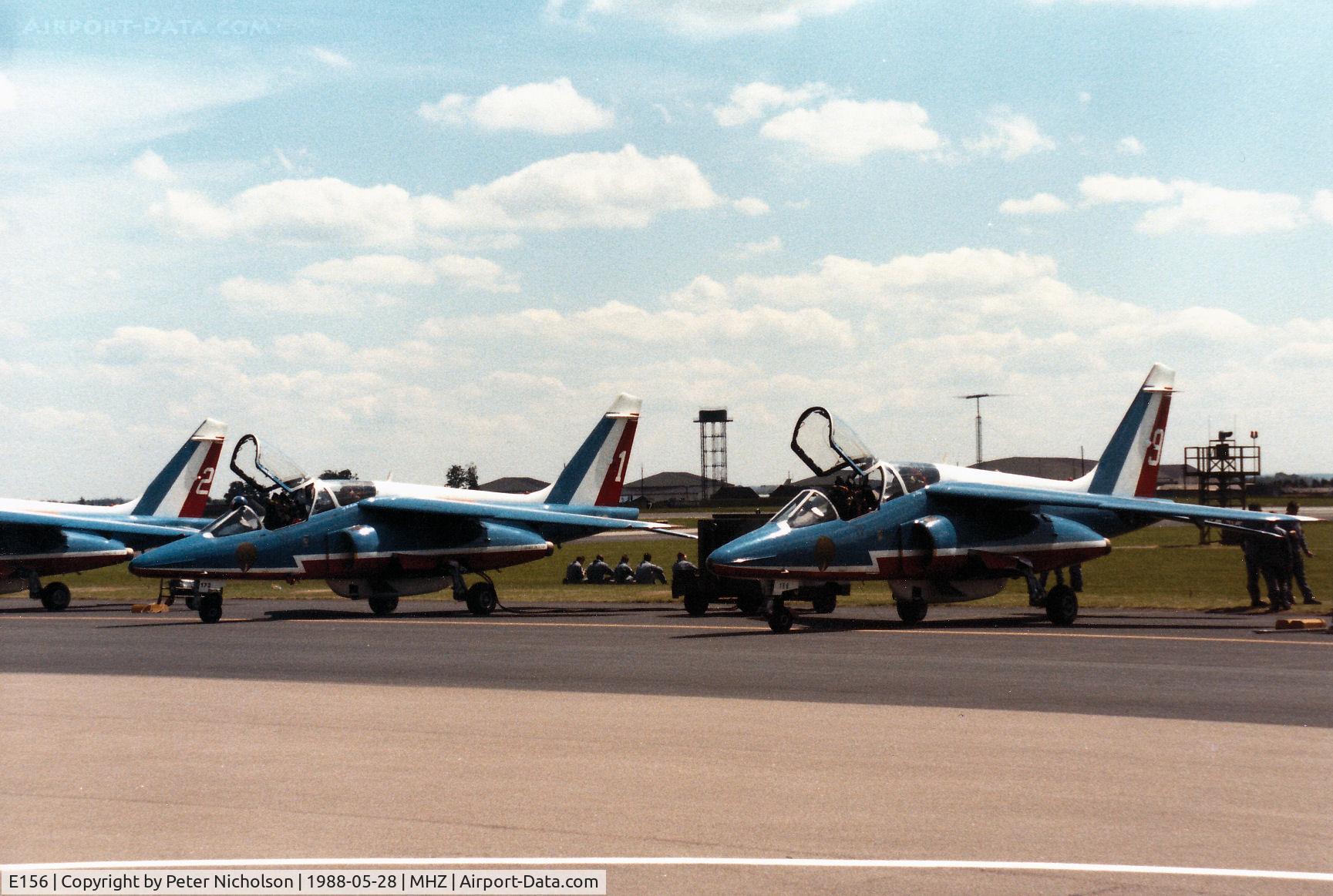 E156, Dassault-Dornier Alpha Jet E C/N E156, Alpha Jet number 9 of the Patrouille de France aerobatic display team, alongside E173 number 1, on the flight-line at the 1988 RAF Mildenhall Air Fete.