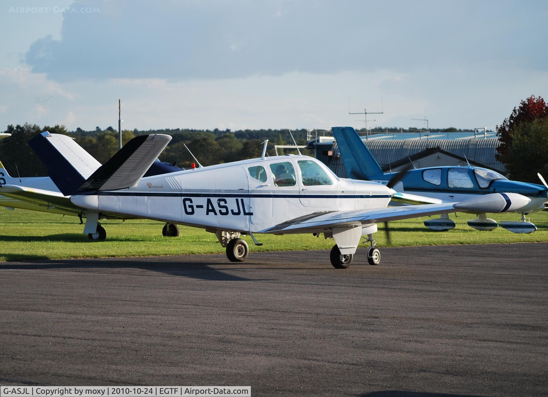 G-ASJL, 1957 Beech H35 Bonanza C/N D-5132, Bonanza at Fairoaks. Ex N5582D