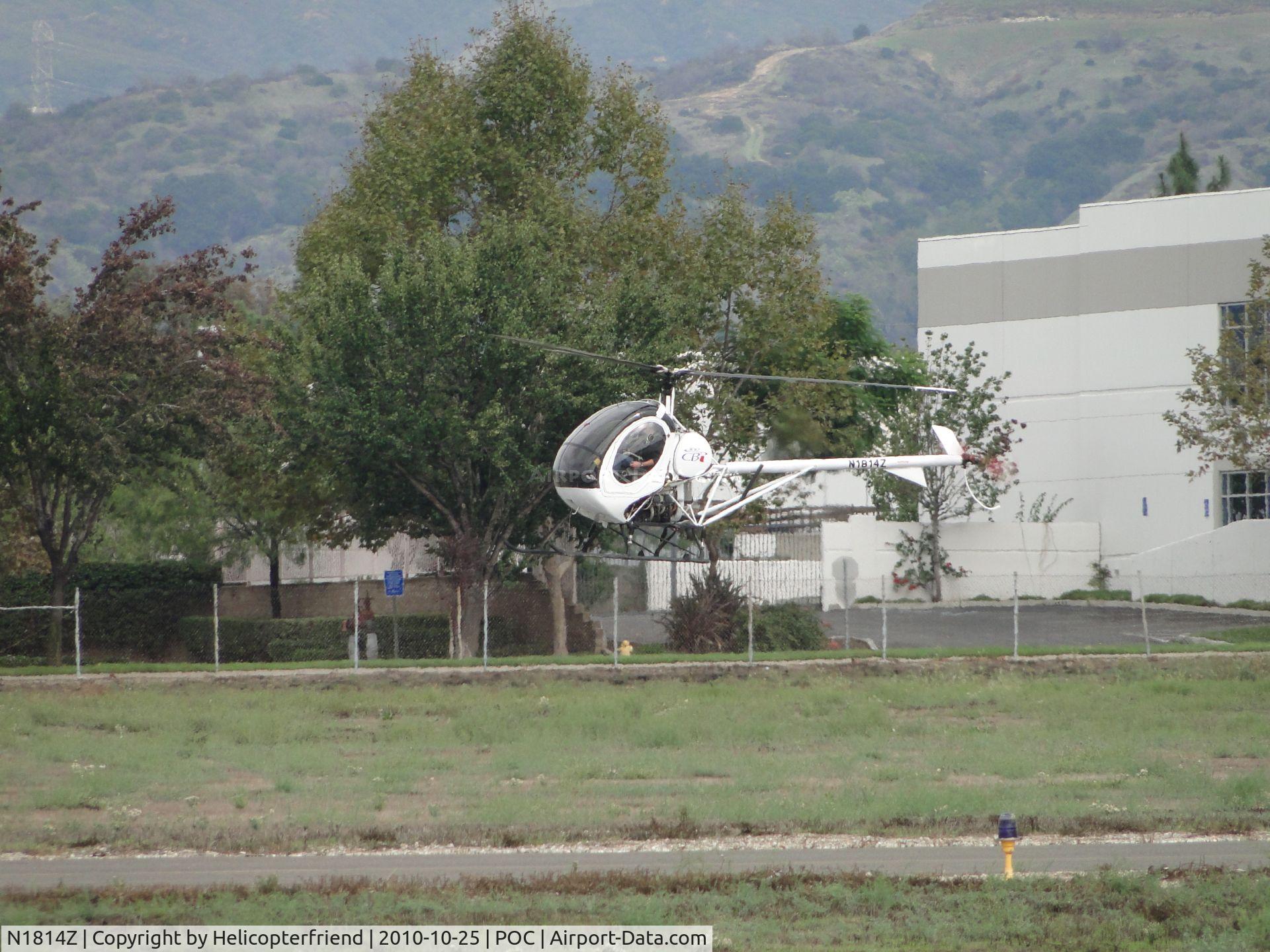 N1814Z, 2007 Schweizer 269C-1 C/N 0304, Hovering over helicopter practice area