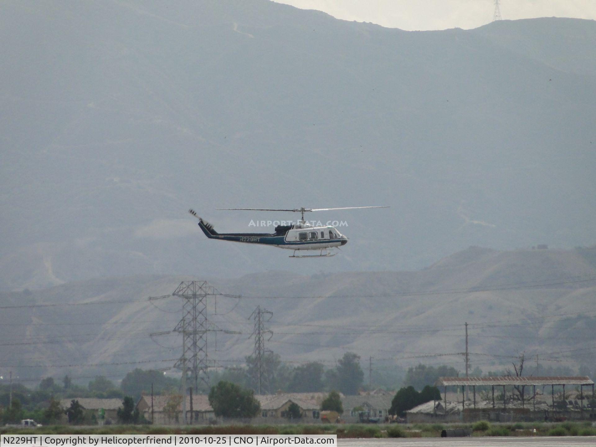 N229HT, 1980 Bell 205A-1 C/N 30330, Gaining altitude for downwind leg for another approach