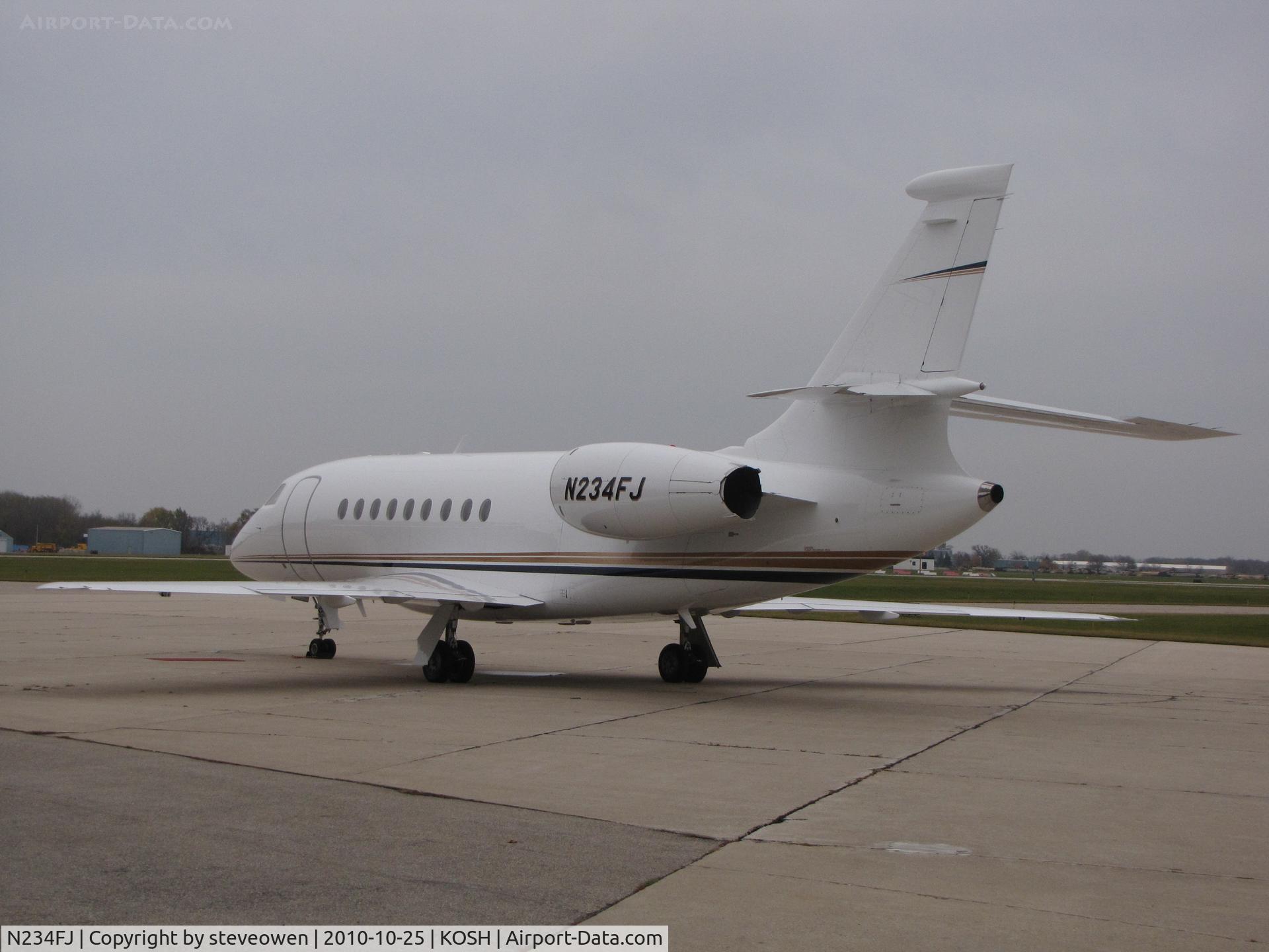 N234FJ, 1996 Dassault Falcon 2000 C/N 34, Orion Ramp @KOSH at Dusk
