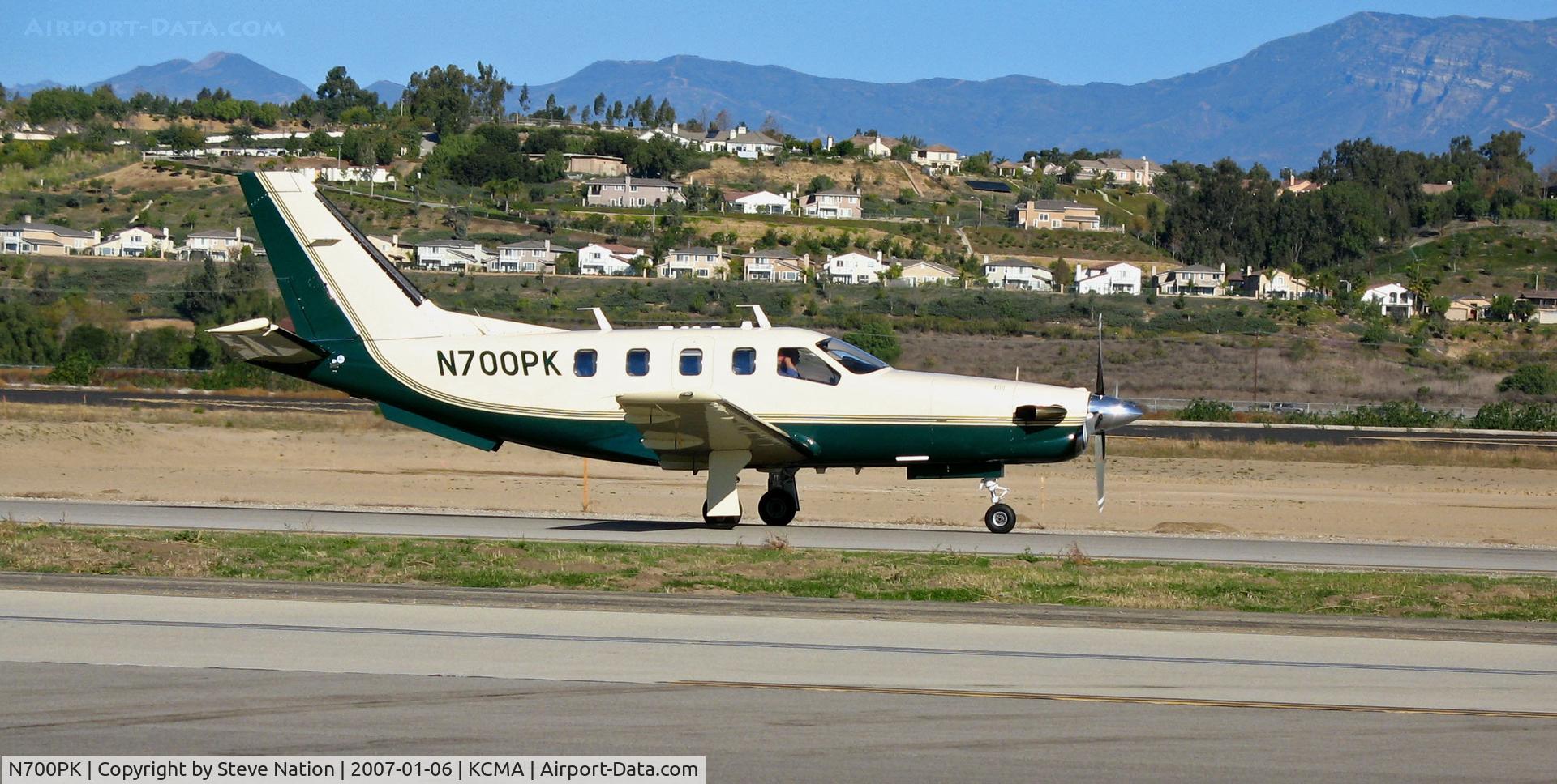N700PK, 1994 Socata TBM-700 C/N 052, 1994 TBM700 rolling out on beautiful, balmy January day with Transverse Range in background