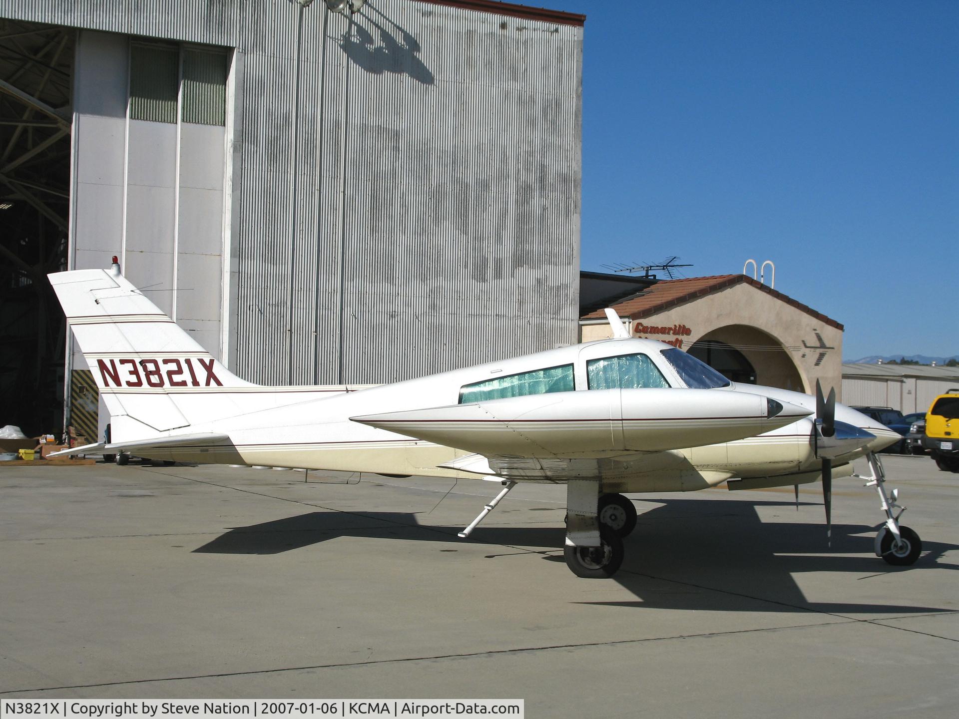N3821X, 1966 Cessna 310K C/N 310K0221, 1966 Cessna 310K in for maintenance on sunny, balmy ramp at Camarillo Airport in early Jan 2007