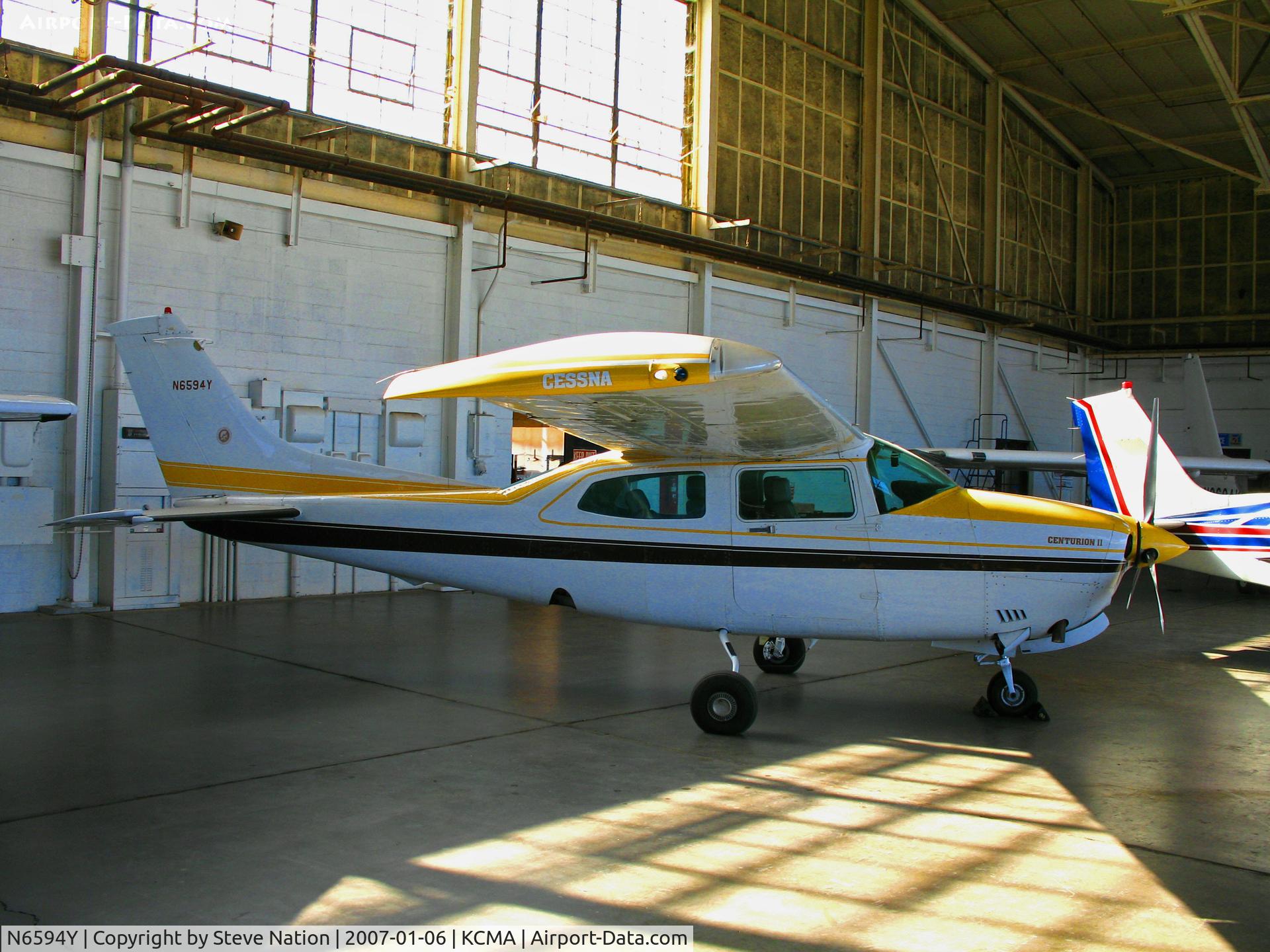 N6594Y, 1981 Cessna T210N Turbo Centurion C/N 21064448, Home-based 1981 Cessna T210N rests in hanger at Camarillo Airport, CA on sunny, warm Jan day (now registered to owner in Arizona and in new blue/white colors)