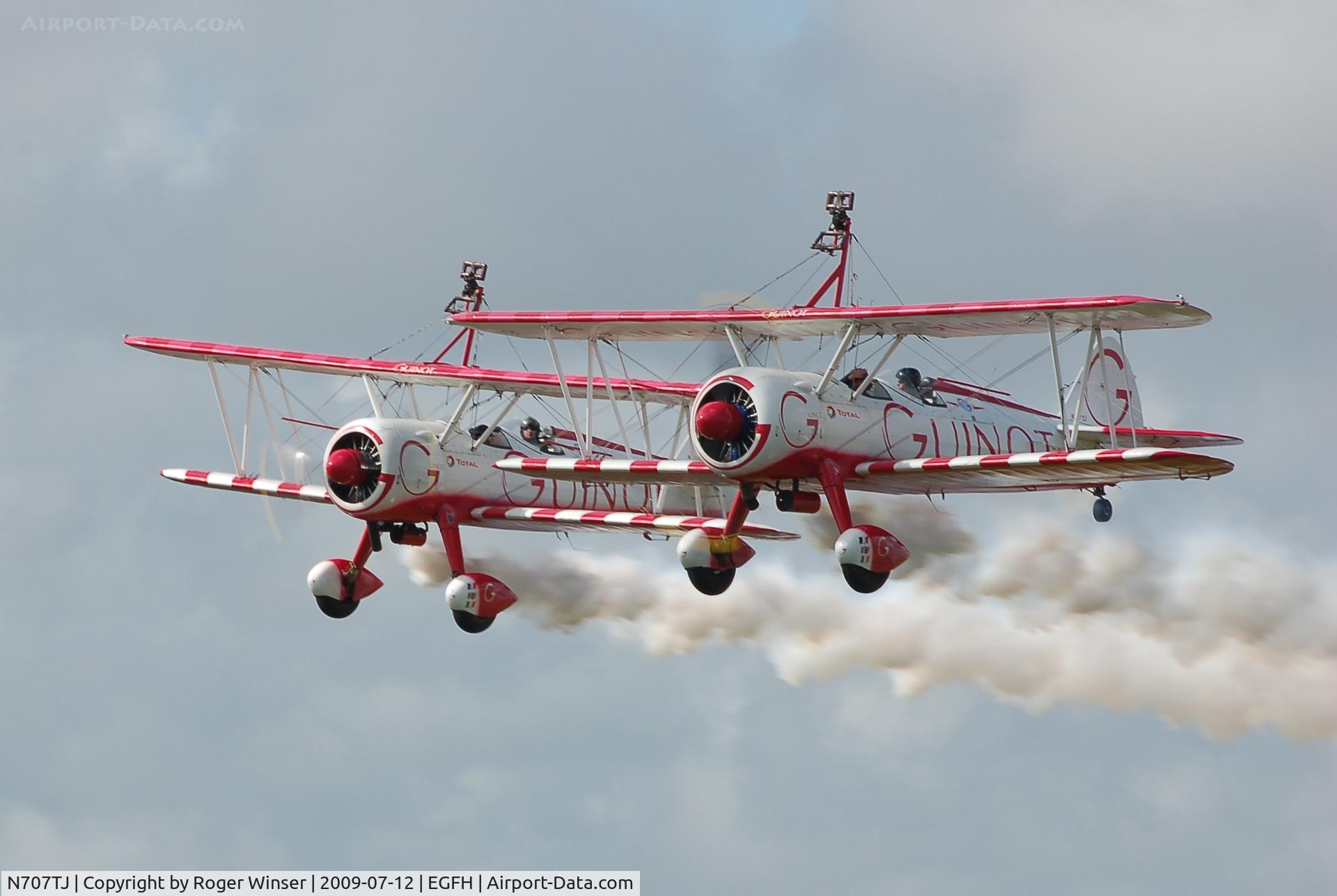 N707TJ, 1943 Boeing A75N1(PT17) C/N 75-950, Team Guinot. N707TJ (trois/3) leading N74189 (deux/2) in a formation take off after displaying at the Wales National Airshow, Swansea Bay.