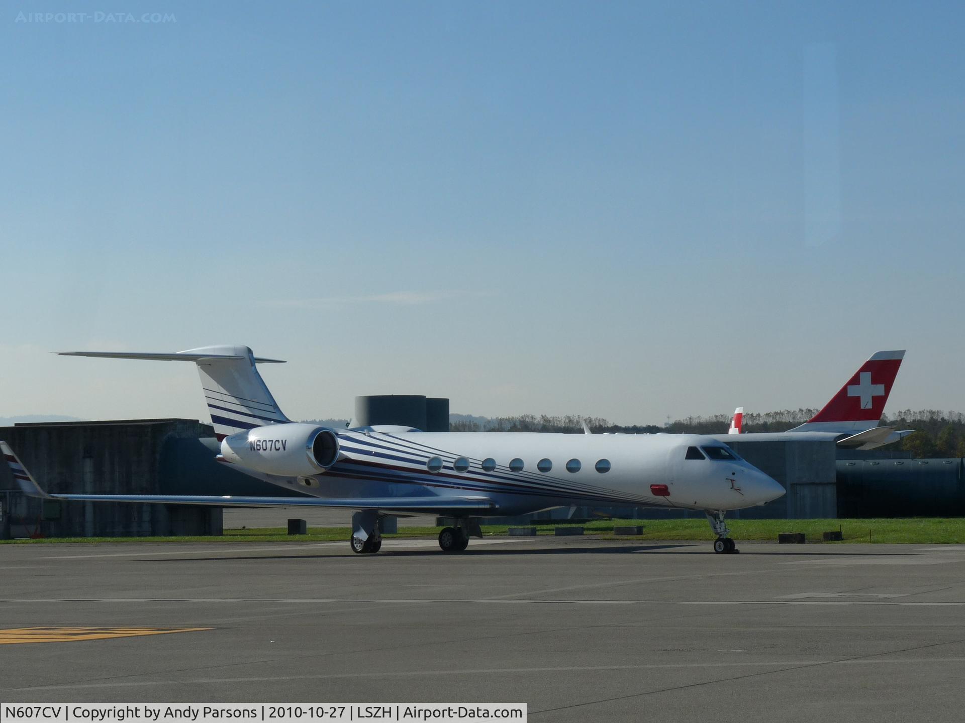 N607CV, 2004 Gulfstream Aerospace GV-SP (G550) C/N 5035, Not bad considering this was taken through a coach window