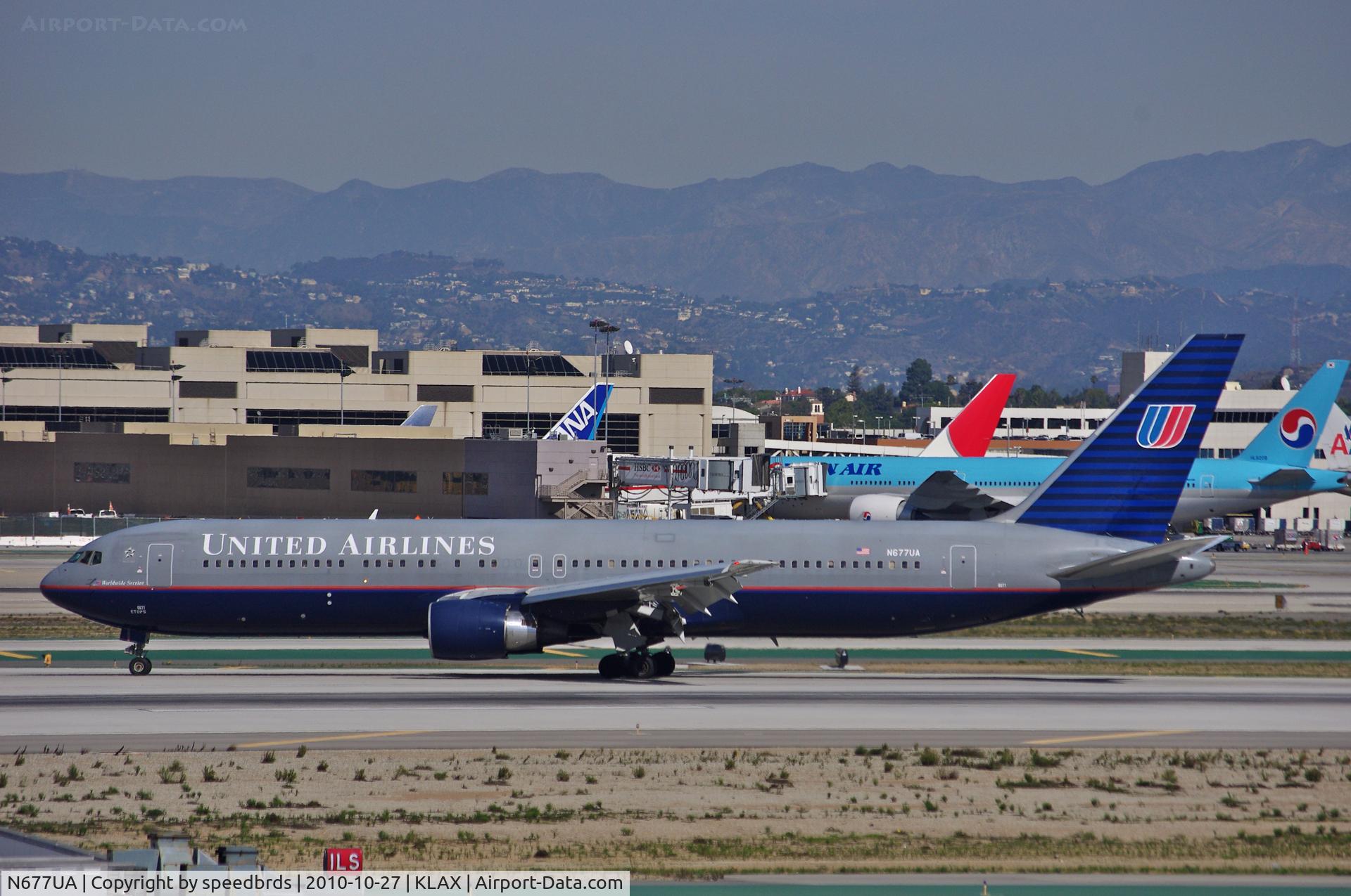 N677UA, 2001 Boeing 767-322 C/N 30029, United Airlines moments after landing.