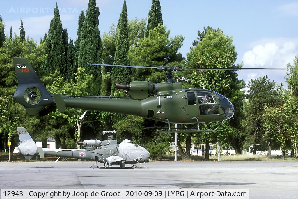 12943, Soko HN-45M (SA-342H) Gama C/N 163, Former Serbia and Montenegro AF Gazelle now taken on charge by the Montenegrin AF. During recent overhaul weapons carrying provisions have been removed. In the background a armed version that is still to be overhauled