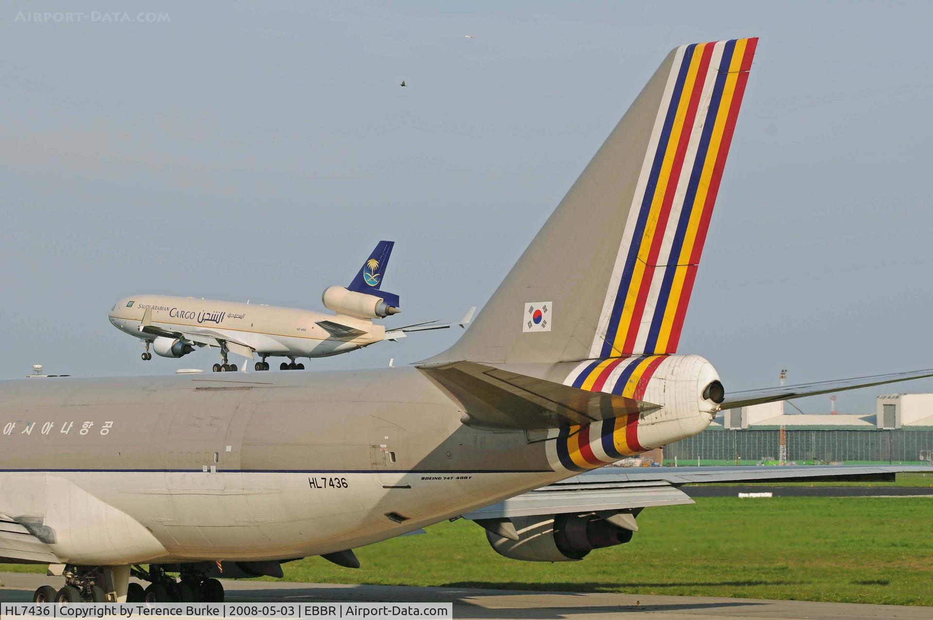 HL7436, 2002 Boeing 747-48EF (SCD) C/N 29170, Genuine Photograph (Honest) No photoshop work etc..HL7436 + (Saudi MD11 HZ-ANA, 07L Brussels.)