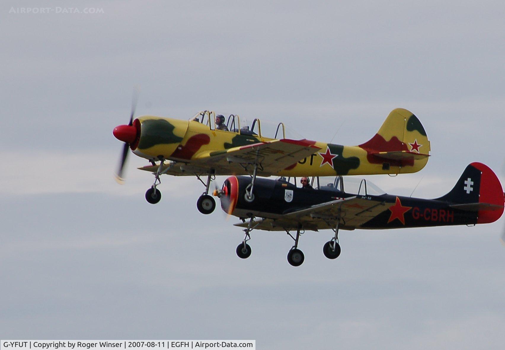 G-YFUT, 1988 Bacau Yak-52 C/N 888410, G-YFUT leading G-CBRH in a formation take-off from Runway 22.