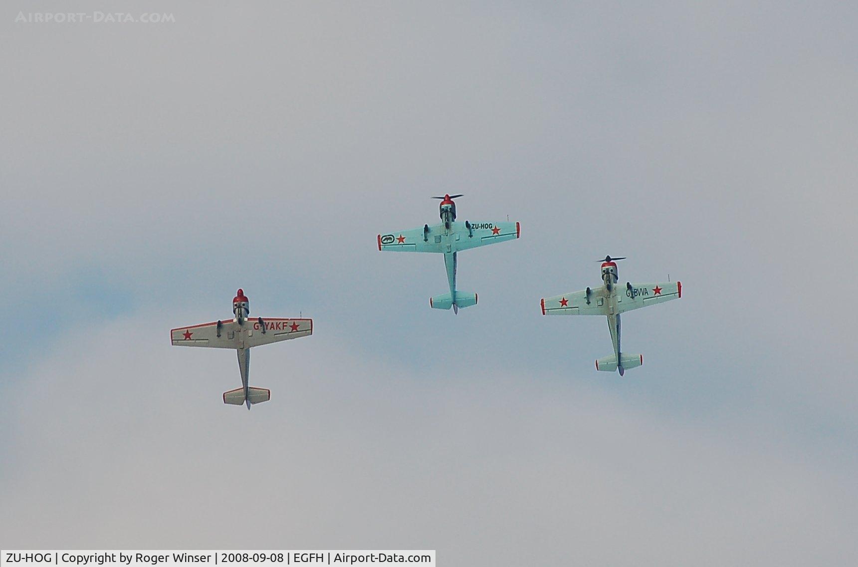 ZU-HOG, 1990 Bacau Yak-52 C/N 9010313, Leading G-YAKF and G-BVVA in 3 ship formation practice.