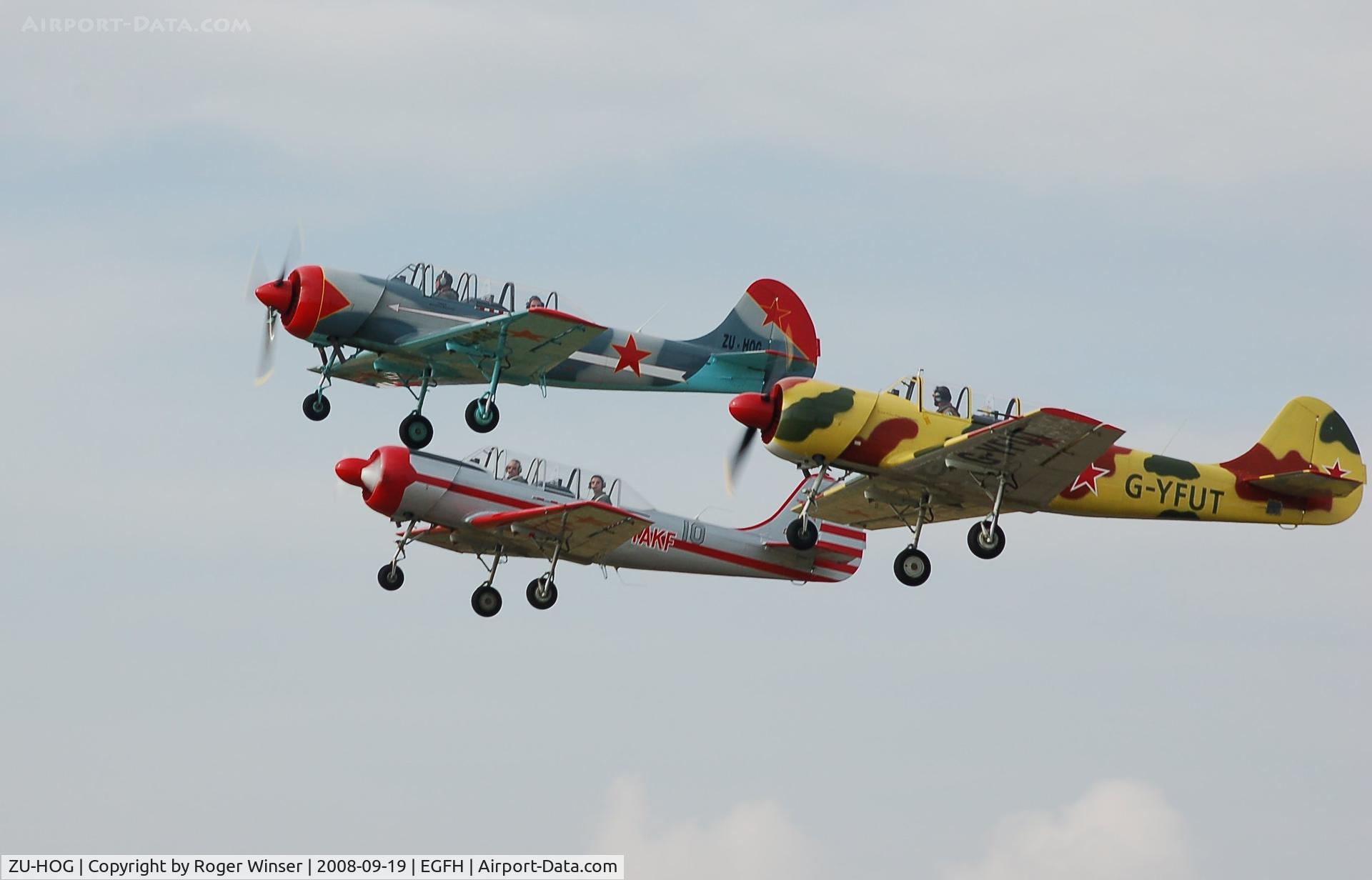 ZU-HOG, 1990 Bacau Yak-52 C/N 9010313, Leading G-YAKF and G-YFUT in a formation take-off 