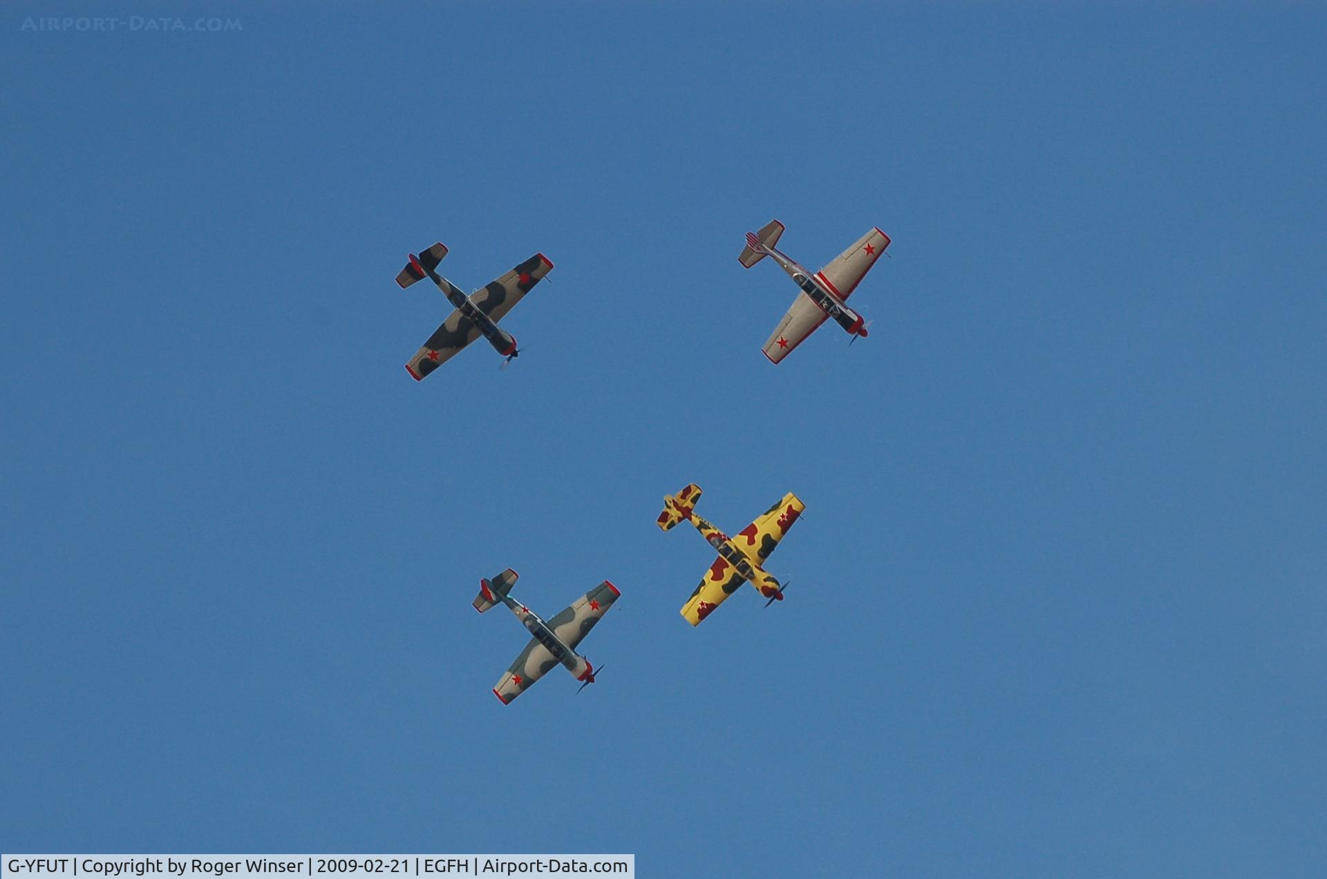 G-YFUT, 1988 Bacau Yak-52 C/N 888410, Leading a 4 ship Team Osprey in a loop during formation aerobatics training over the airport.