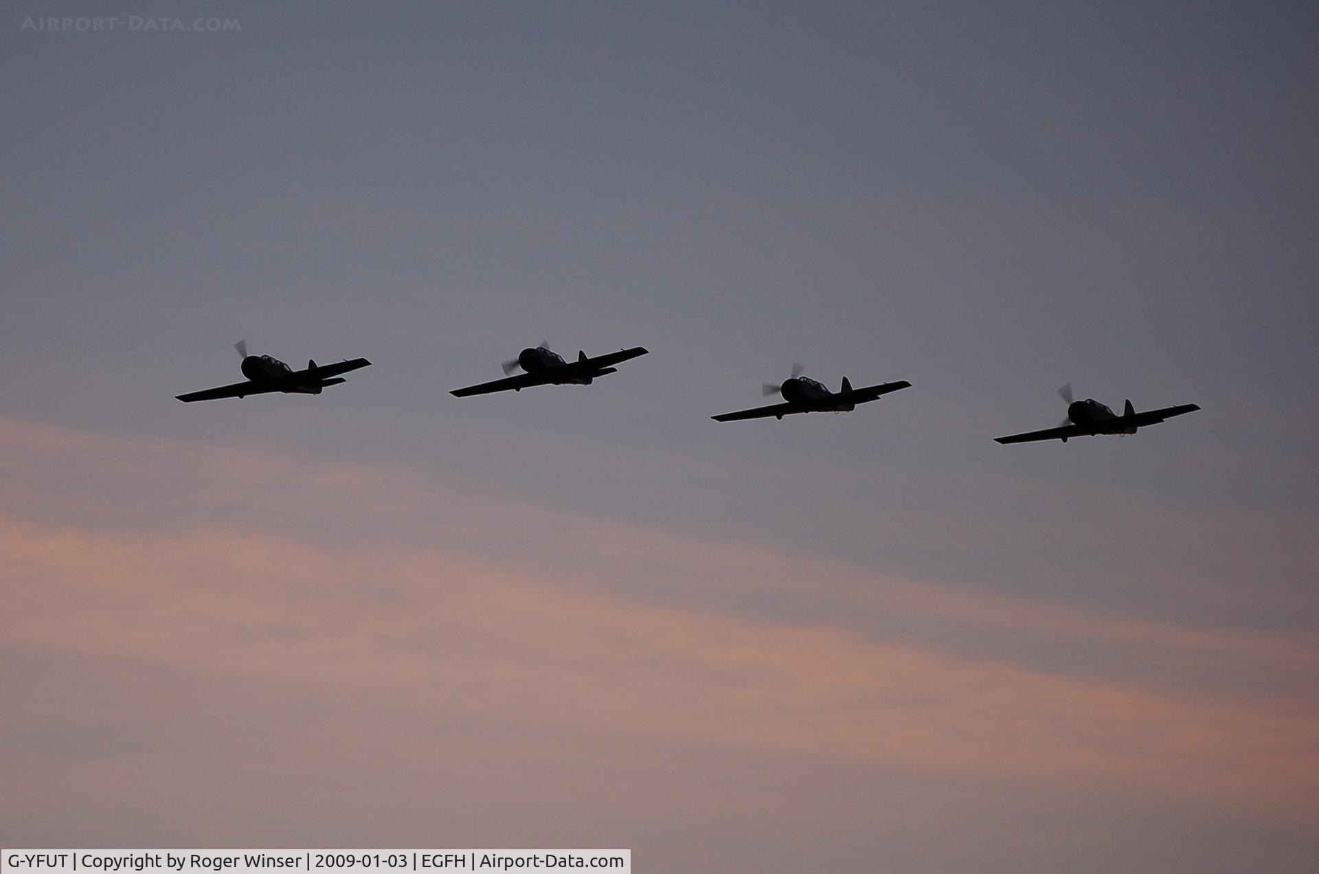 G-YFUT, 1988 Bacau Yak-52 C/N 888410, G-YFUT leading a four ship Team Osprey formation returning from formation aerobatics practice.