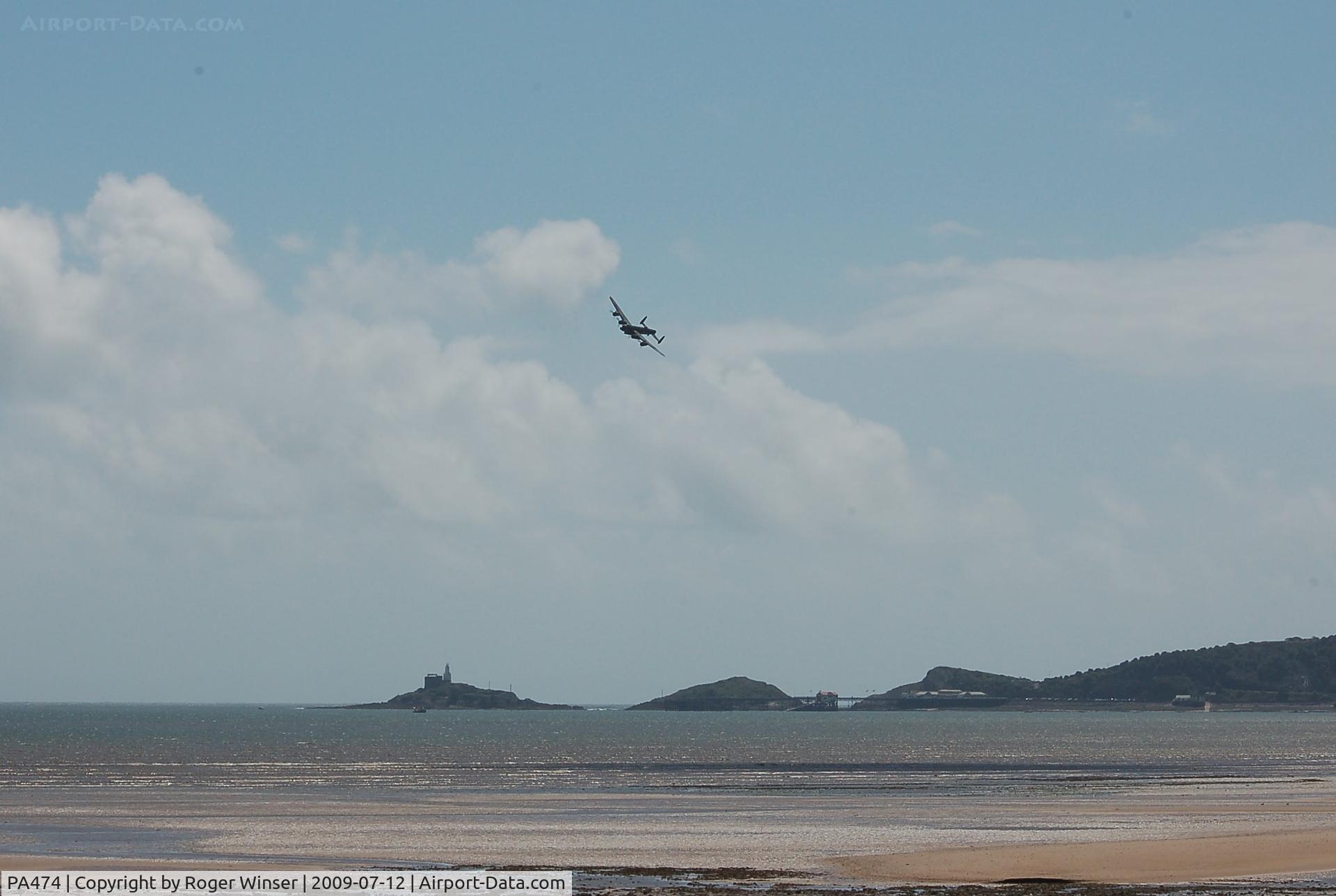 PA474, 1945 Avro 683 Lancaster B1 C/N VACH0052/D2973, Off airport. BBMF's Avro Lancaster B.1 flying over Swansea Bay, Wales, UK