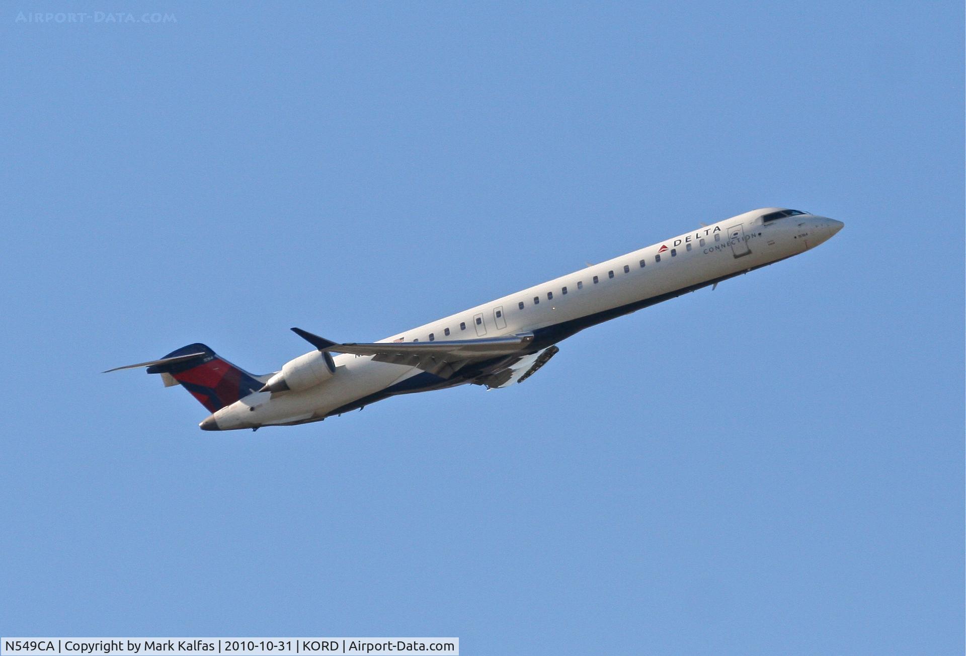 N549CA, 2008 Bombardier CRJ-900ER (CL-600-2D24) C/N 15164, COMAIR/Delta Connection, COM582, N549CA with a right crosswind departure 32R KORD en-route to KJFK.