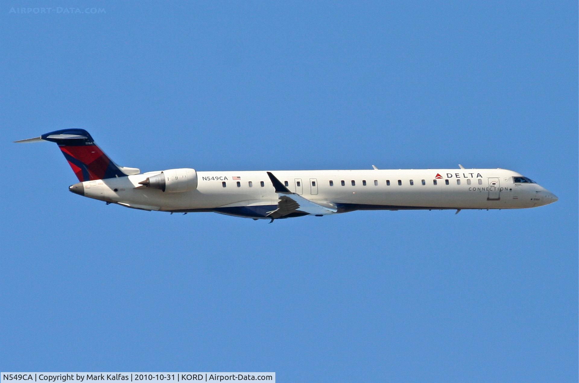N549CA, 2008 Bombardier CRJ-900ER (CL-600-2D24) C/N 15164, COMAIR/Delta Connection, COM582, N549CA with a right crosswind departure 32R KORD en-route to KJFK.