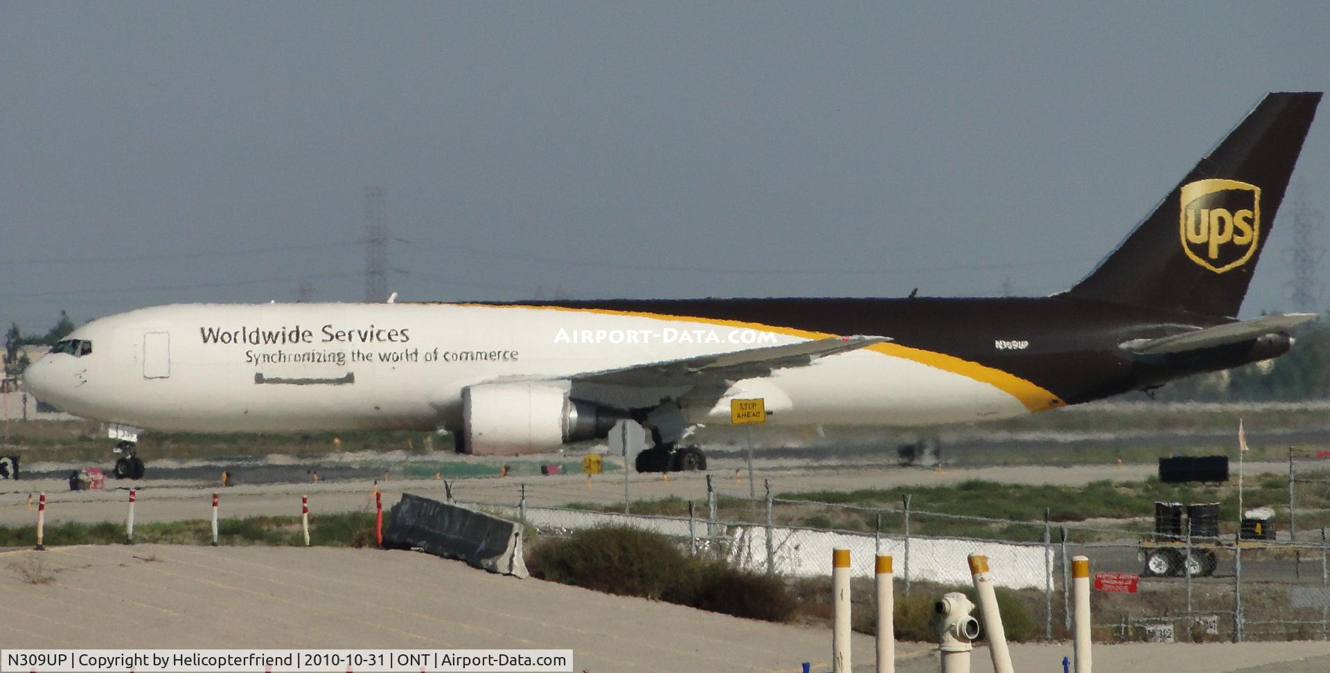 N309UP, 1996 Boeing 767-34AF C/N 27740, Being tested on the taxiway south of runway 26L and preparing to turn right and go back to UPS parking apron