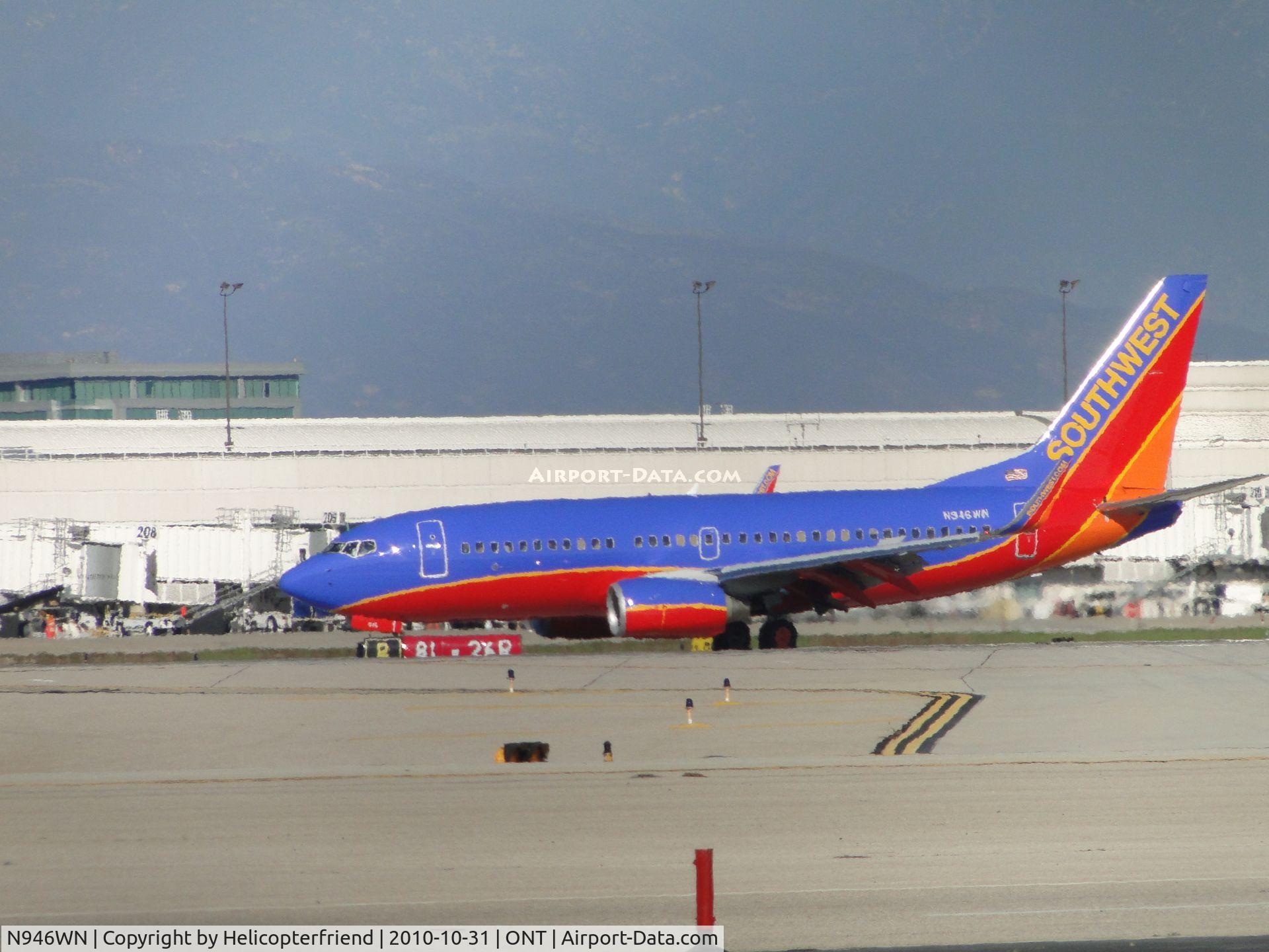 N946WN, 2010 Boeing 737-7H4 C/N 36918, Just landed on runway 26R and slowing down to turn onto taxiway L to go back to Southwest terminal