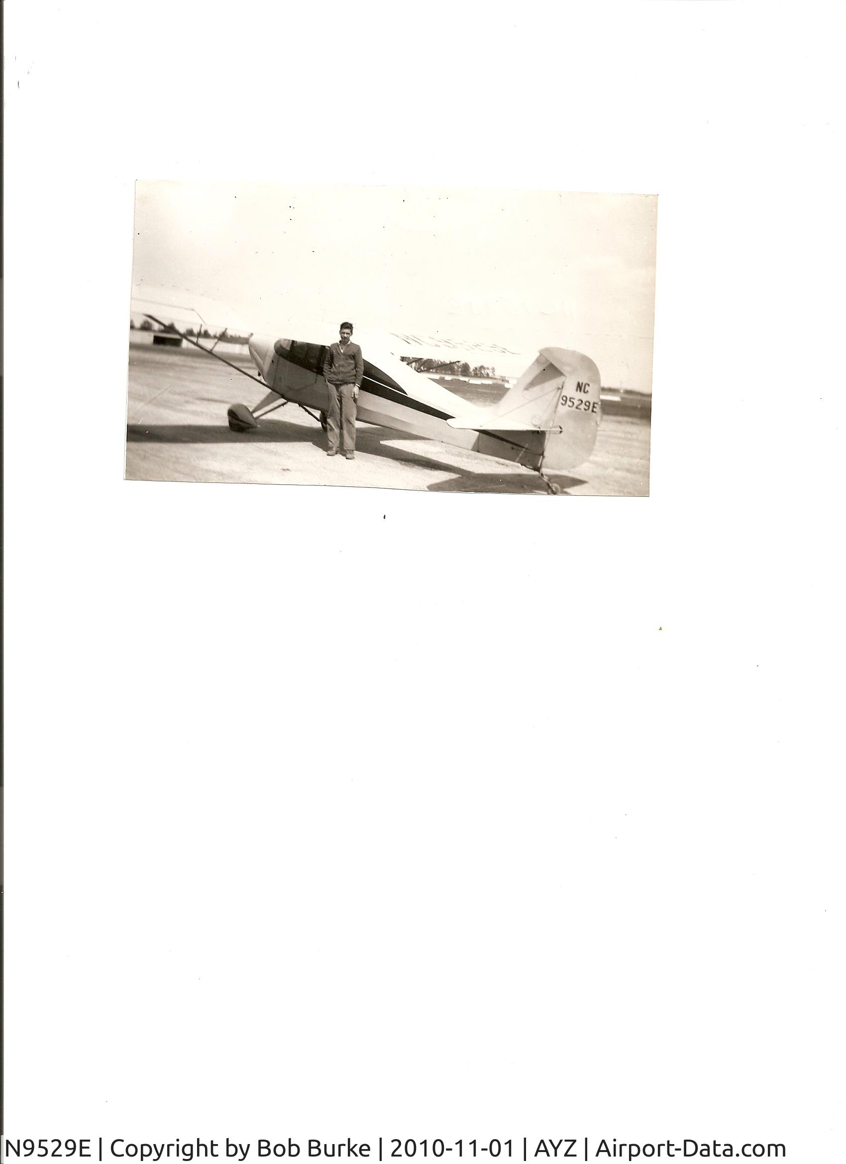 N9529E, 1946 Aeronca 11AC Chief C/N 11AC1165, On ramp at Zahns Airport, Amityville, Long Island circa early 1950's. Ed Ferner standing by aircraft.