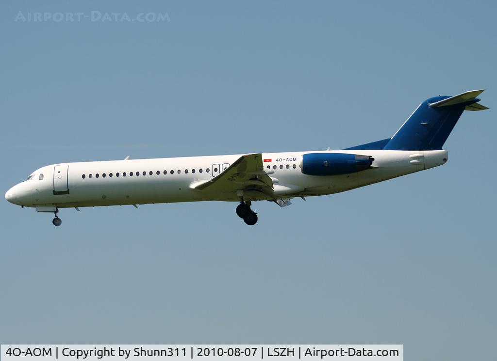 4O-AOM, 1990 Fokker 100 (F-28-0100) C/N 11321, Landing rwy 14