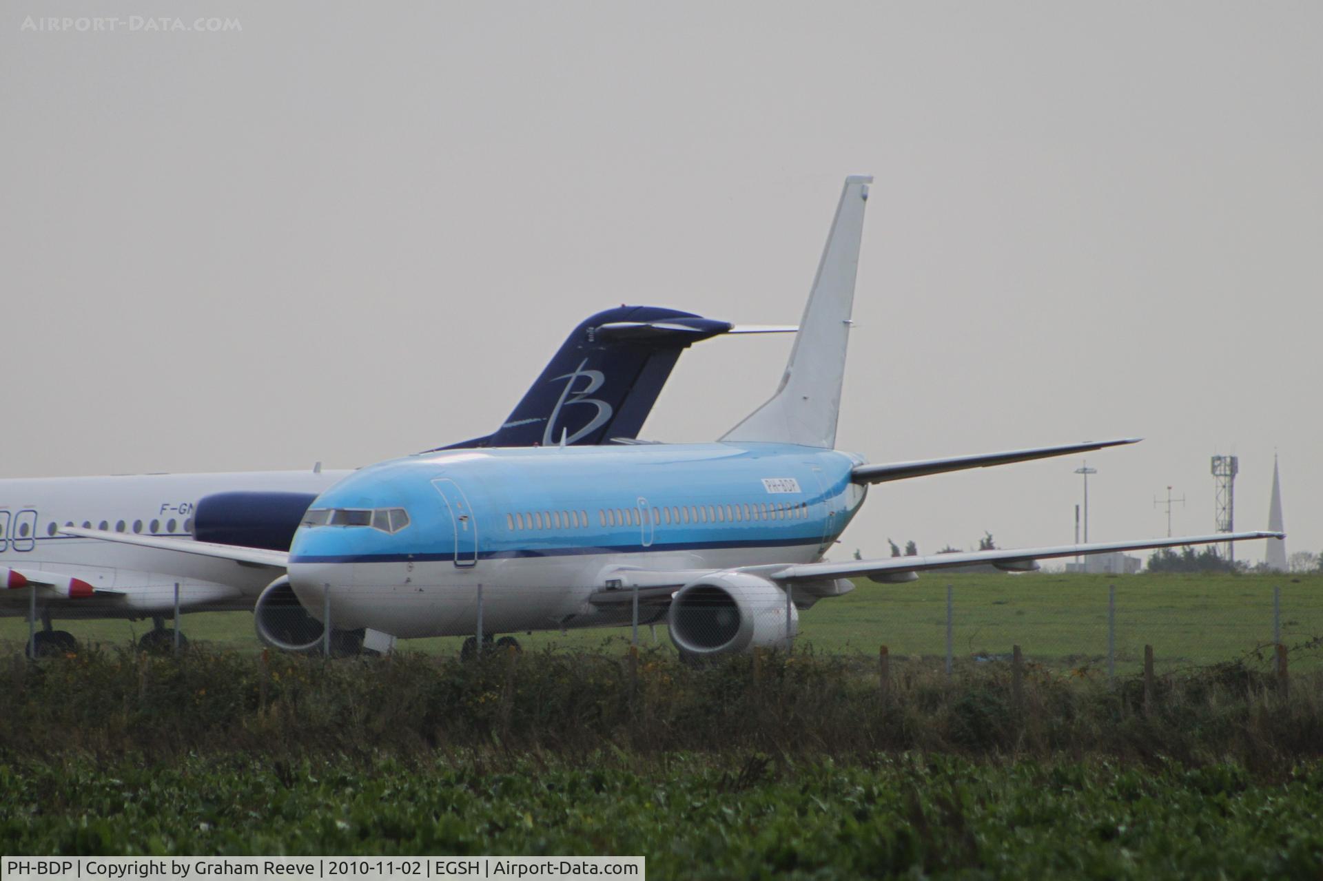 PH-BDP, 1989 Boeing 737-306 C/N 24404, With logos removed but still in KLM colours. Fokker 100 in back ground.