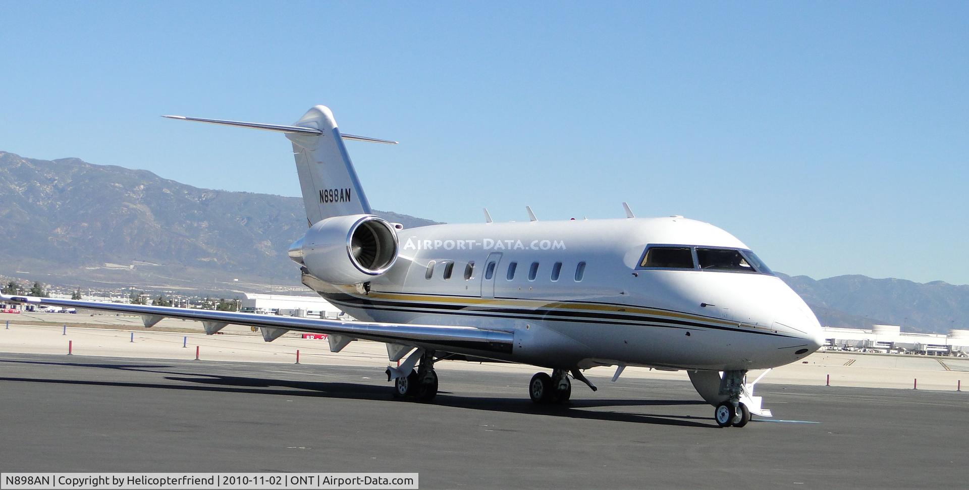 N898AN, 1999 Bombardier Challenger (CL-600-2B16) C/N 5408, Being readied for take off