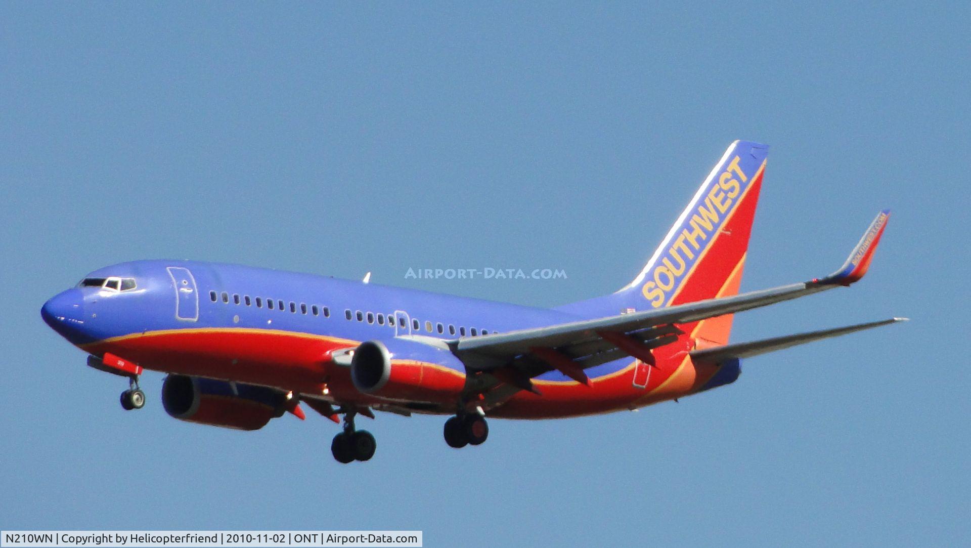 N210WN, 2005 Boeing 737-7H4 C/N 34162, On final approach to runway 26R