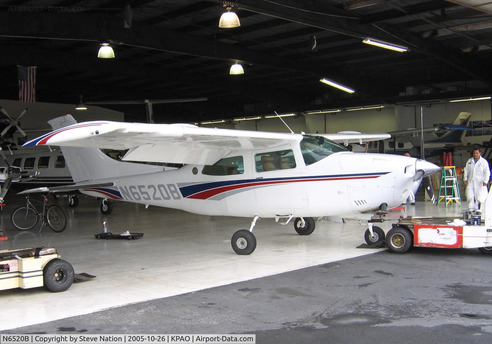 N6520B, 1978 Cessna T210M Turbo Centurion C/N 21062780, 1978 Cessna T210M peeking out of hangar @ Palo Alto, CA home base (to new owner in Cedar City, UT Apr 2010)