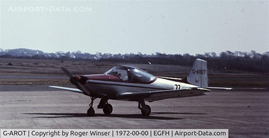 G-AROT, 1961 Aviamilano F-8L Falco Series 3 C/N 224, Carrying race #77. Poor but rare photograph of the resident Falco in the early 1970's. Date is a guess.