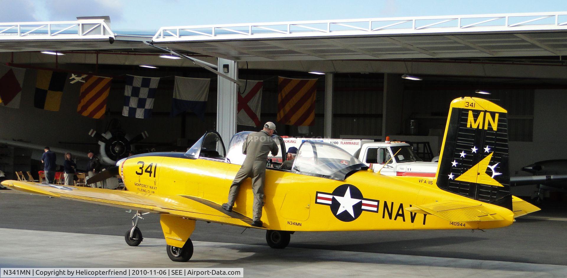 N341MN, 1956 Beech D-45 (T-34B) Mentor C/N BG-278, Pilot assisting passenger with gear and getting ready to fly a four plane formation practice