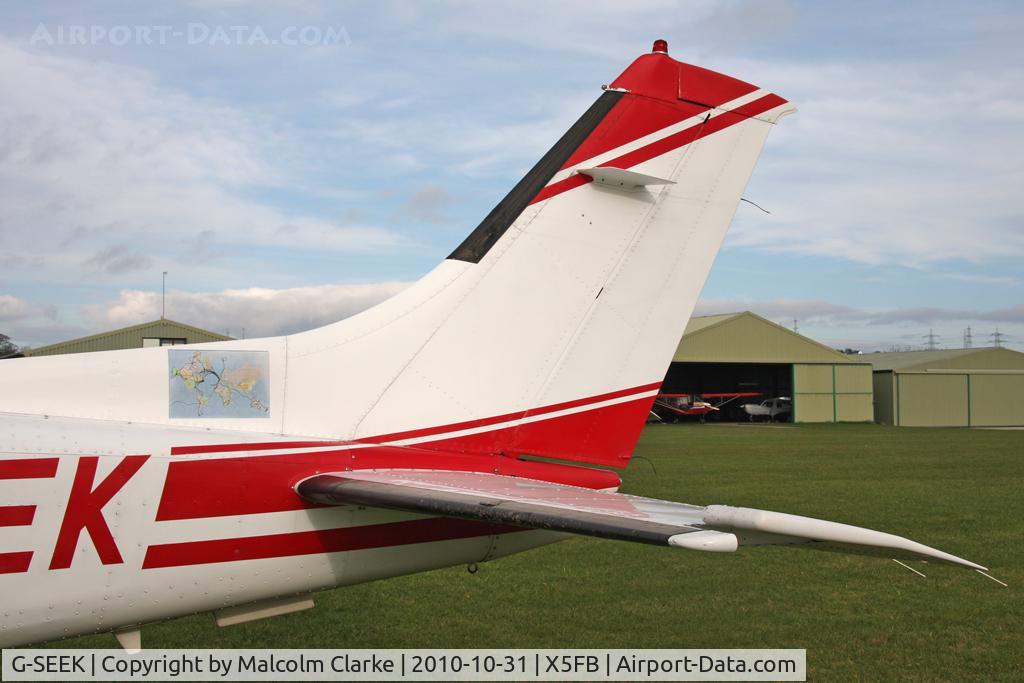 G-SEEK, 1982 Cessna T210N Turbo Centurion C/N 21064579, A tail close-up showing the map of this Cessna T210N's world travels.